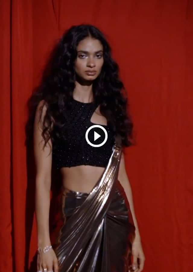Copper Ready Pleated Saree In Metallic Lycra With A Black Embroidered Crop Top With Cut Out Detailing