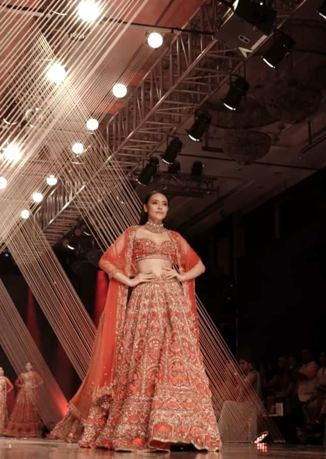 Red Lehenga With A Crop Top In Royal Heritage Embroidery, Crop Top Comes In Sleeveless With A Sweetheart Neckline