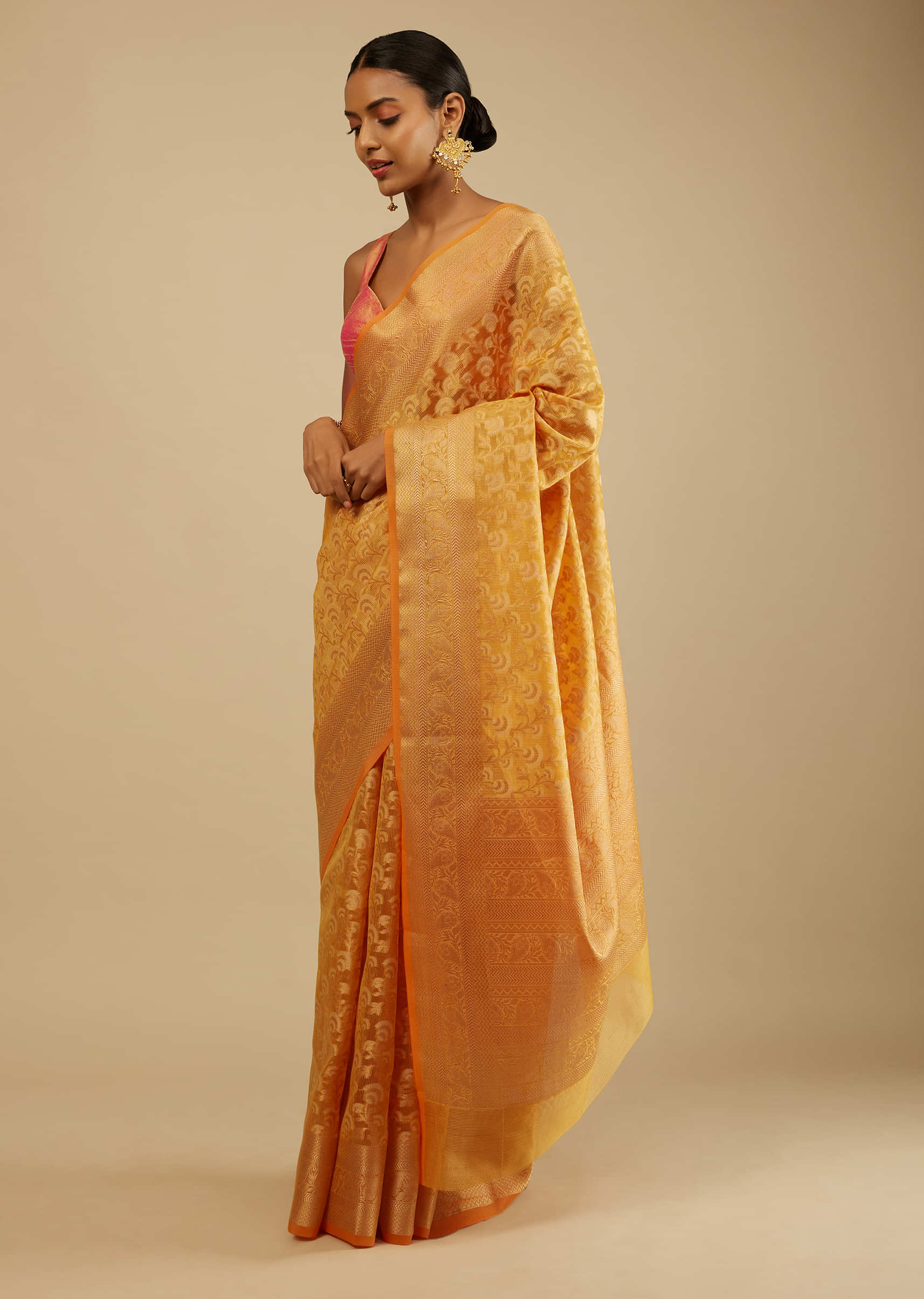 Apricot Yellow Saree In Organza Silk With Woven Floral Jaal In Shades Of White And Gold Along With Unstitched Blouse  