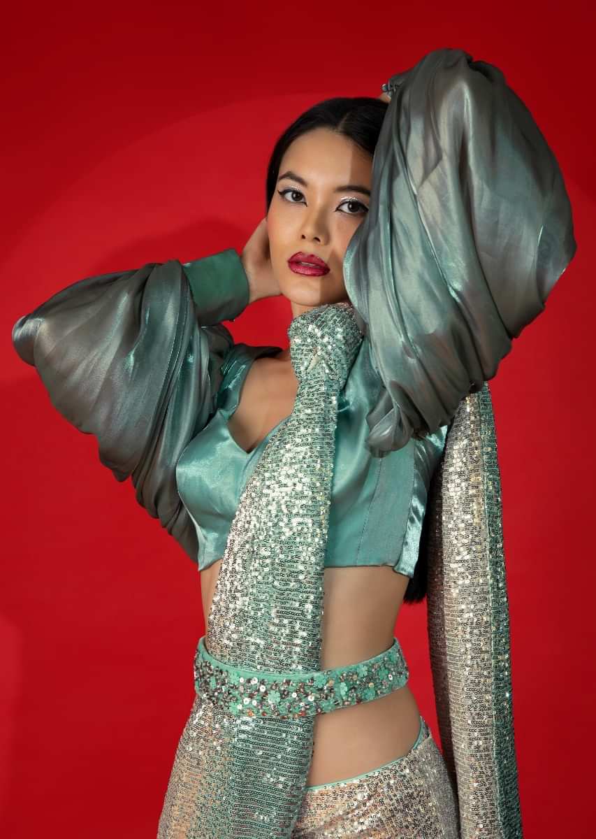 Aqua Green Ombre Ready Pleated Saree Embellished In Sequins With A Aqua And Grey Organza Blouse With Elaborate Balloon Sleeves  
