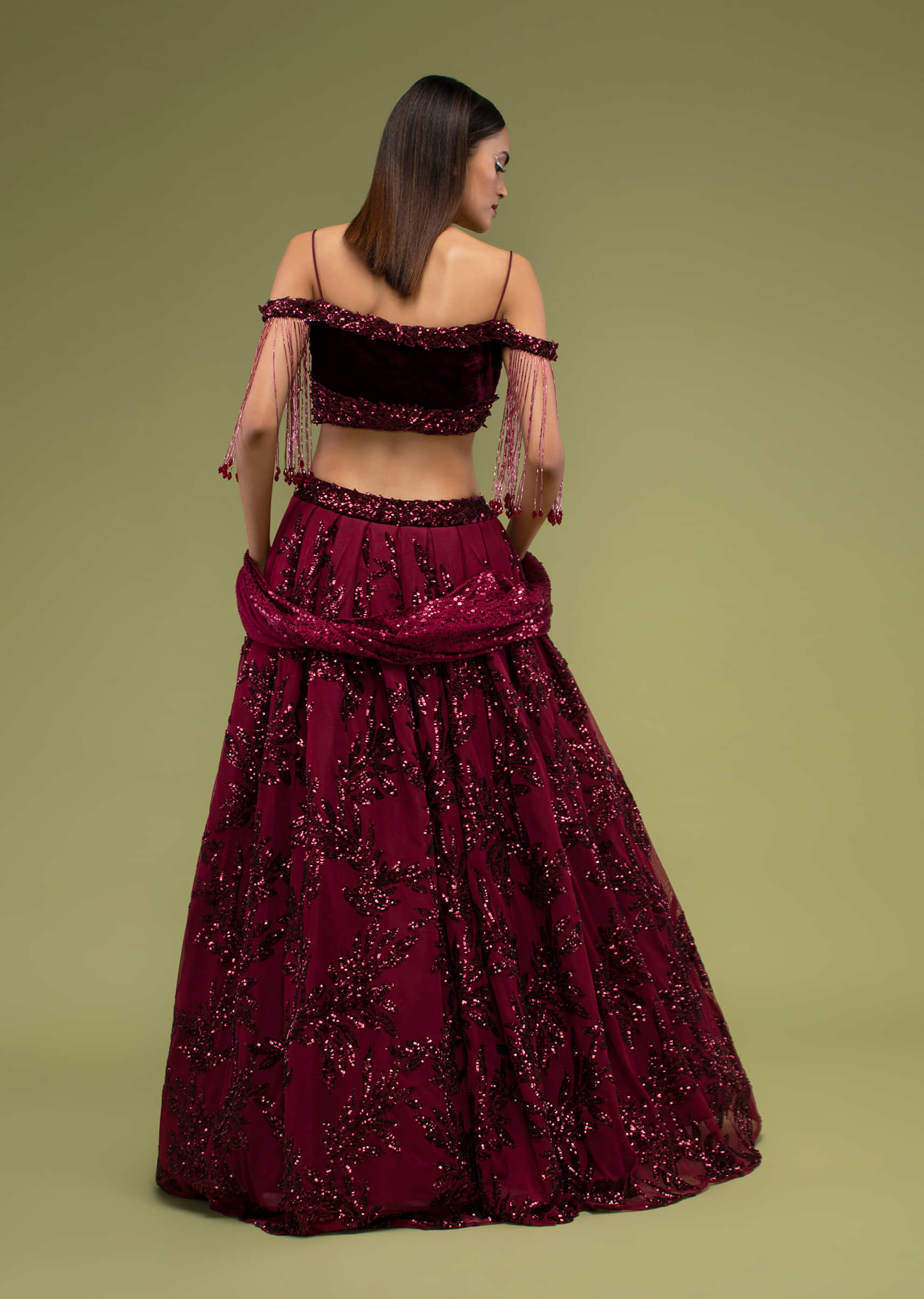 Beet Red Lehenga And Crop Top In Velvet With Sequins Embroidery, Paired With A Crop Top In The Cold Shoulder With Cape In Cut Dana Cascading Down