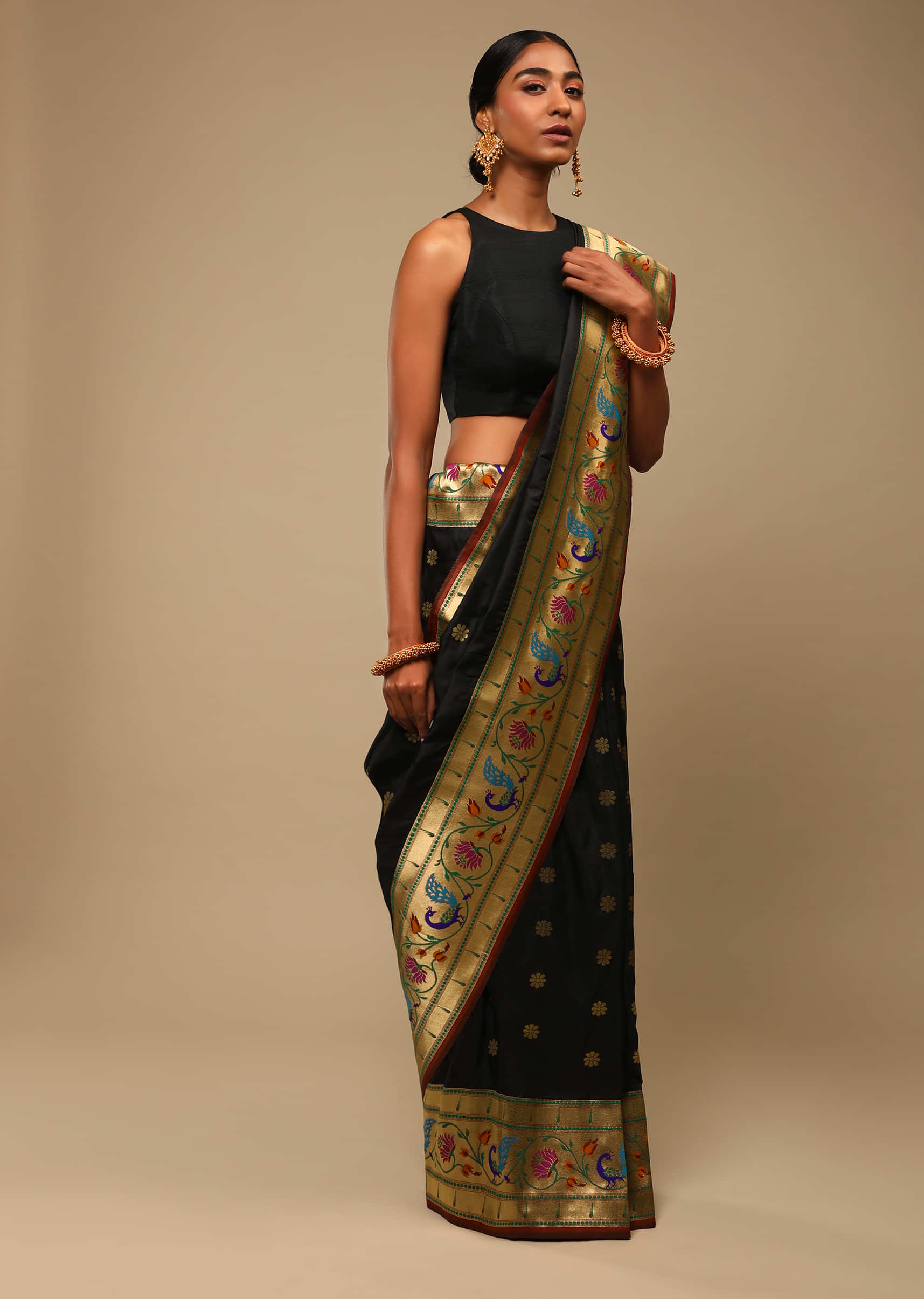 Black Saree In Art Handloom Silk With Woven Multi Colored Peacock Motifs On The Border, Floral Buttis And Unstitched Blouse  