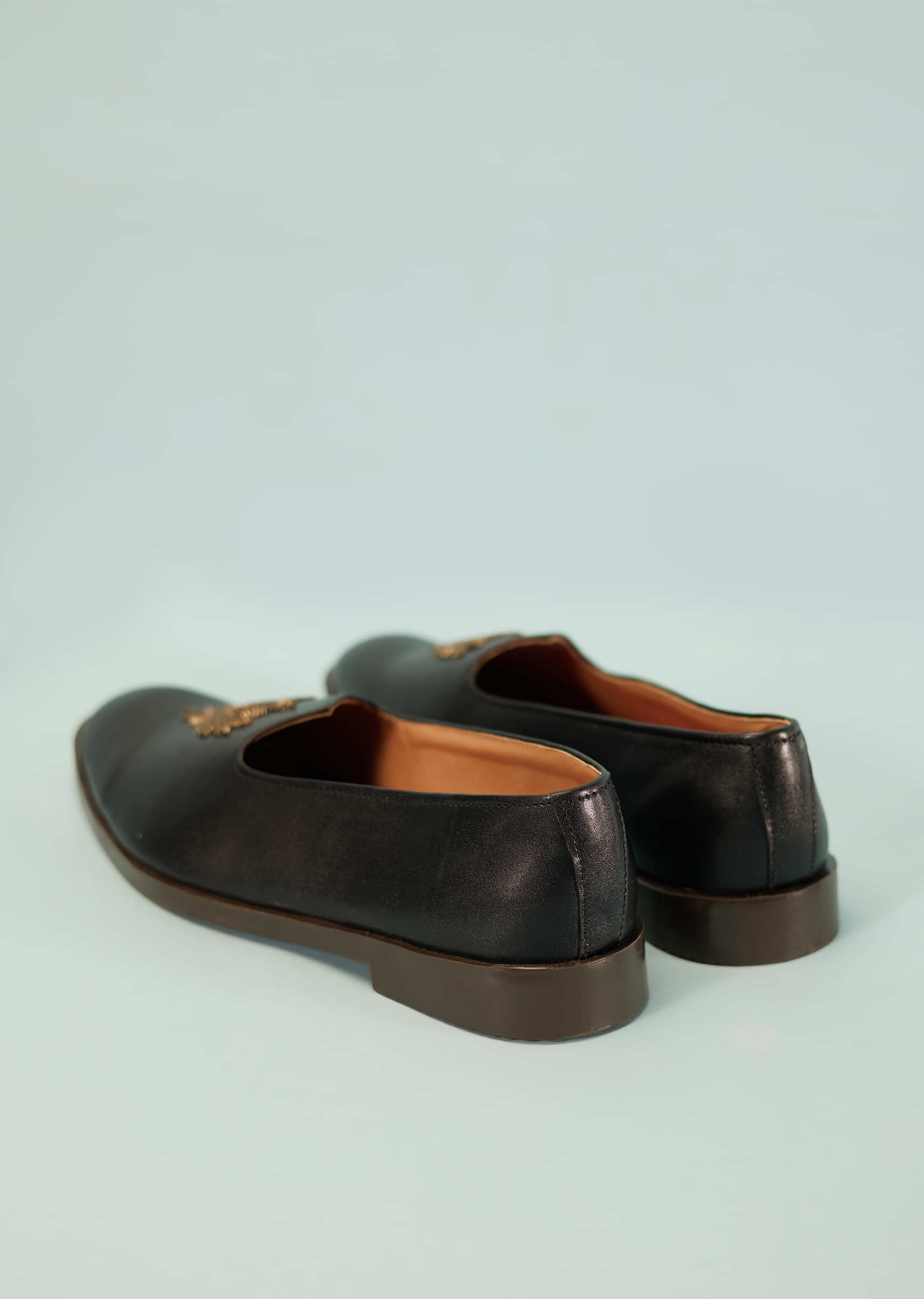 Black Juttis In Leather With Zari Embroidered Motif
