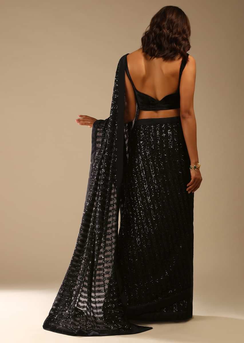 Black Ready Pleated Saree Embellished In Sequins And A Sleeveless Velvet Blouse With A Front Cut Out  