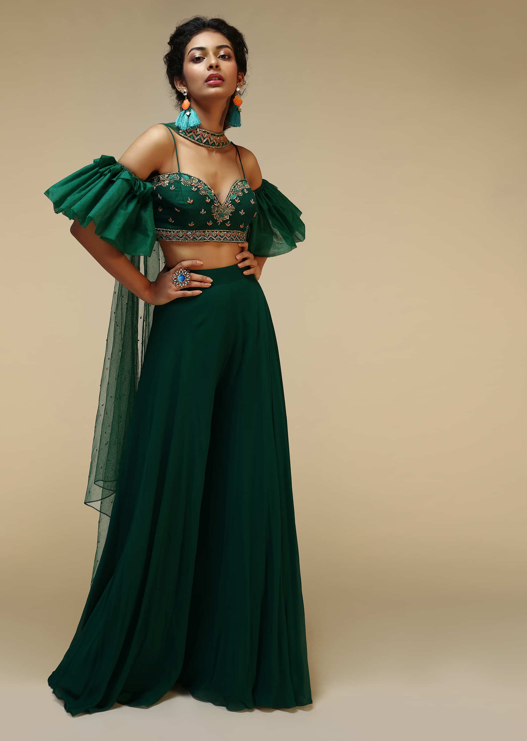 Bottle Green Palazzo Suit With A Cold Shoulder Crop Top Featuring Short Bell Sleeves And Multi Colored Hand Embroidery  