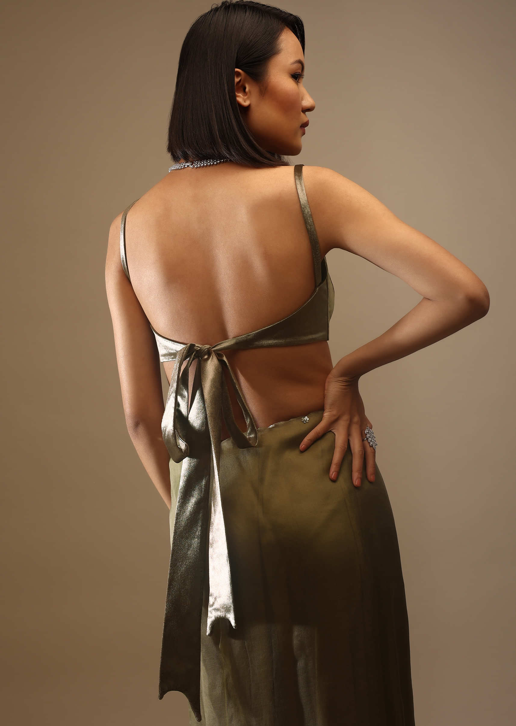 Butternut Olive Satin Spaghetti Strap Blouse With A Curved Neckline Tie Down At The Back