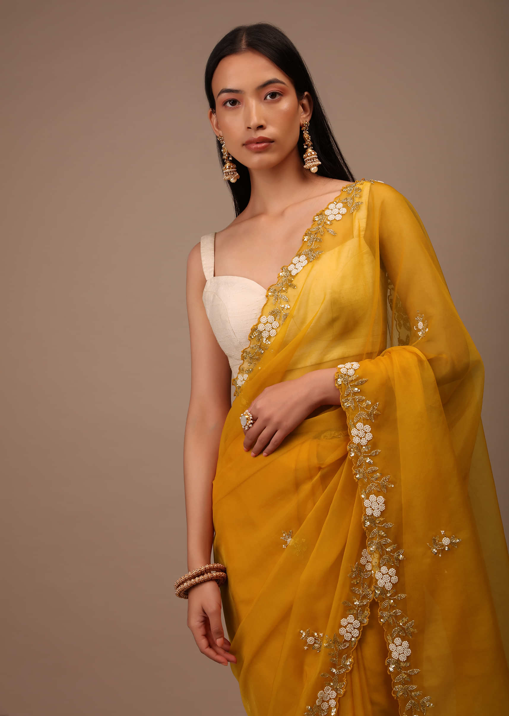 Butterscotch Yellow Saree In Organza With Hand Embroidered Moti And Cut Dana Work On The Border And Butti Design