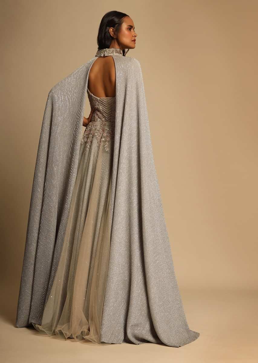 Champagne Embellished Gown With Plunging Neckline And A Fancy Choker With Attached Cape