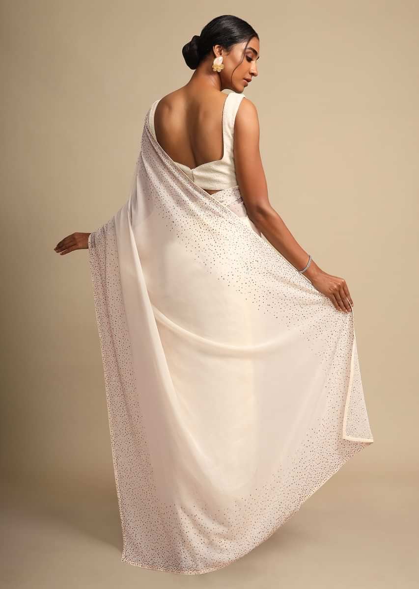 Daisy White Saree In Georgette With Kundan Embellished Border Online - Kalki Fashion