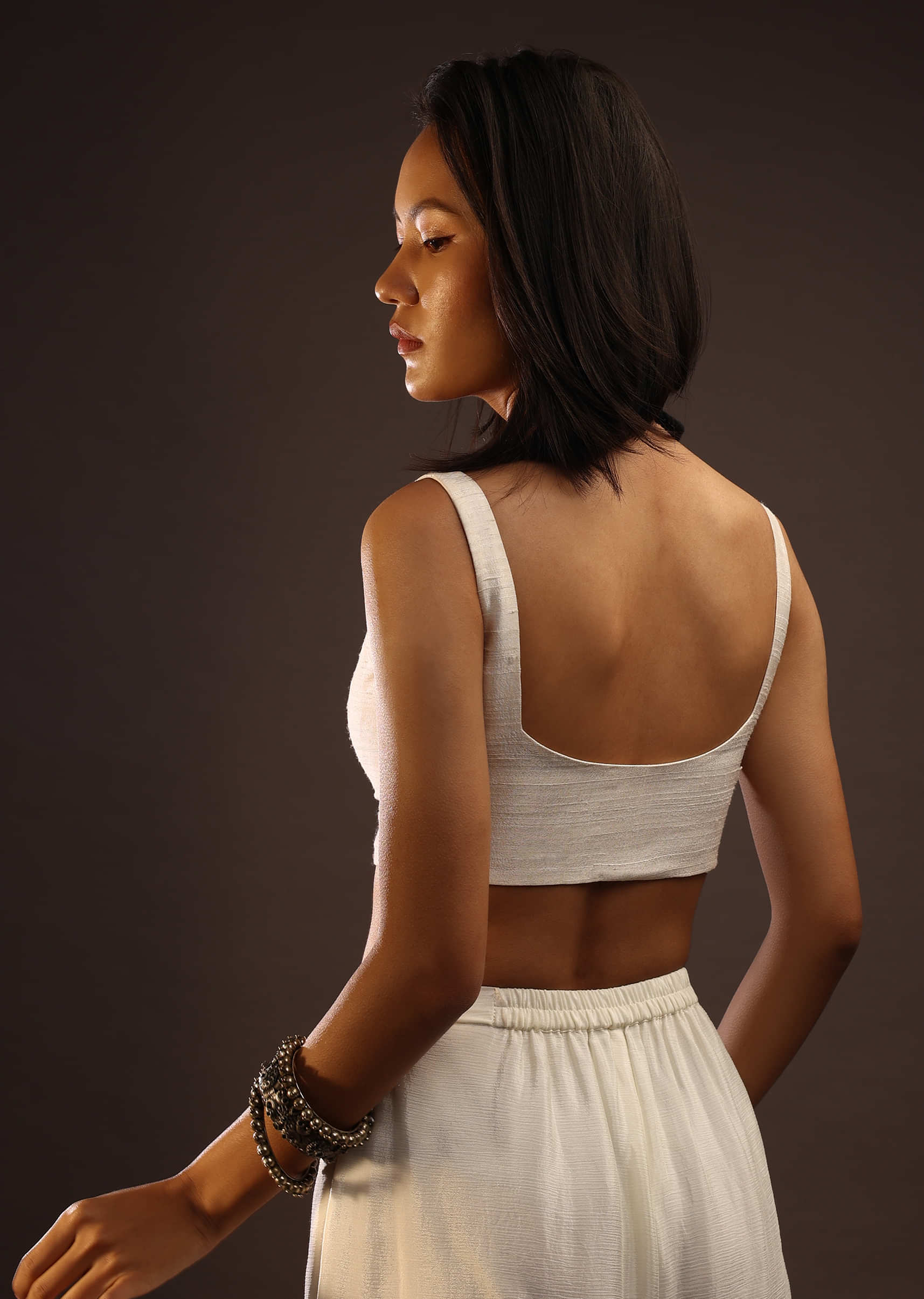Egret White  Sleeveless Blouse With A Sweetheart Neckline. Padded With A Back Hook Closure
