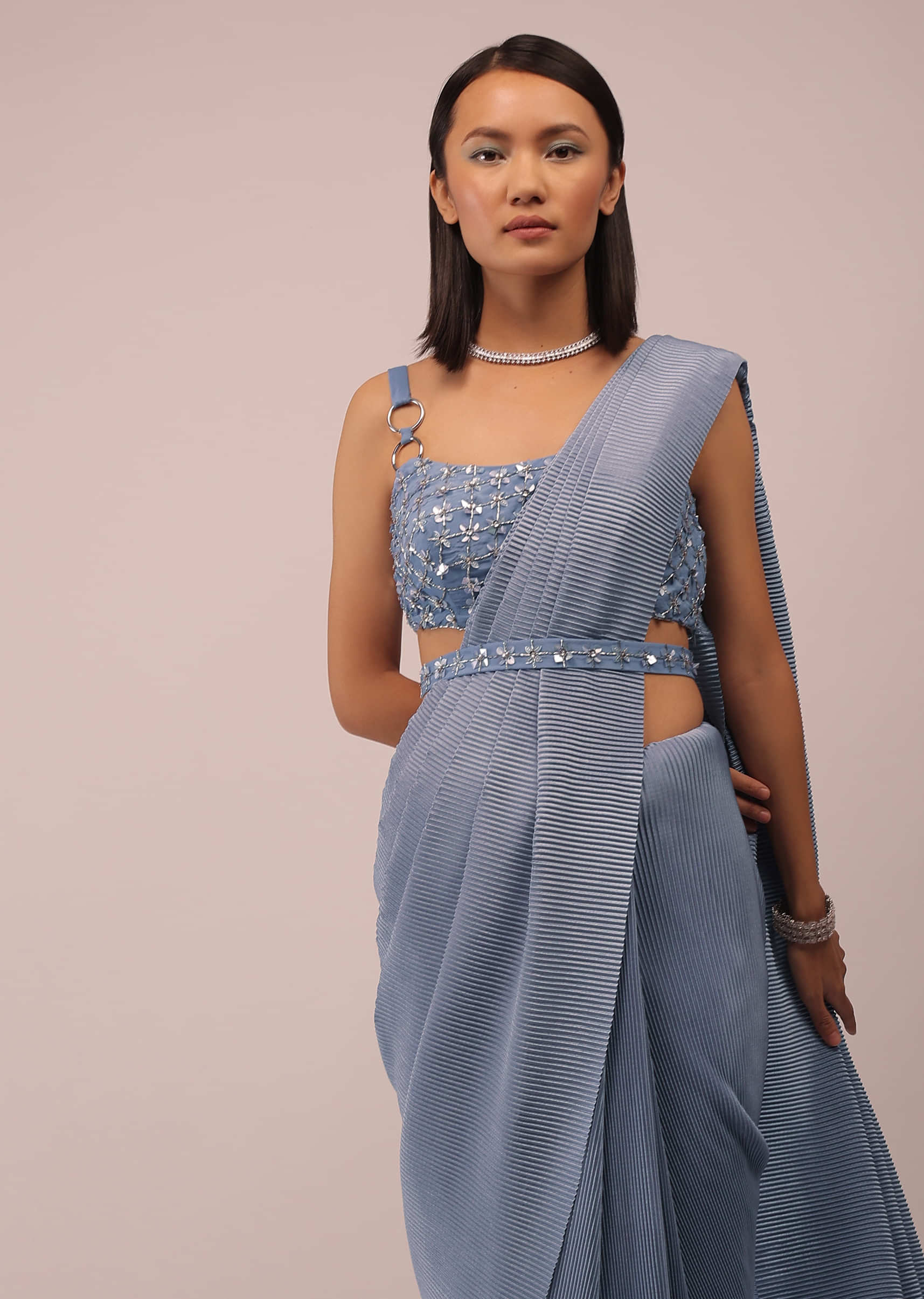 Faded Denim Saree With Buckle Strap Sleeves Crop Top In Sequins Embroidery With An Embroidery Belt In Sequins And 3D Petals