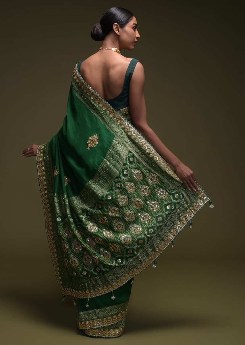 Forest Green Saree In Crepe Silk Blend With Gotta Patti Embroidered Buttis And Woven Border  