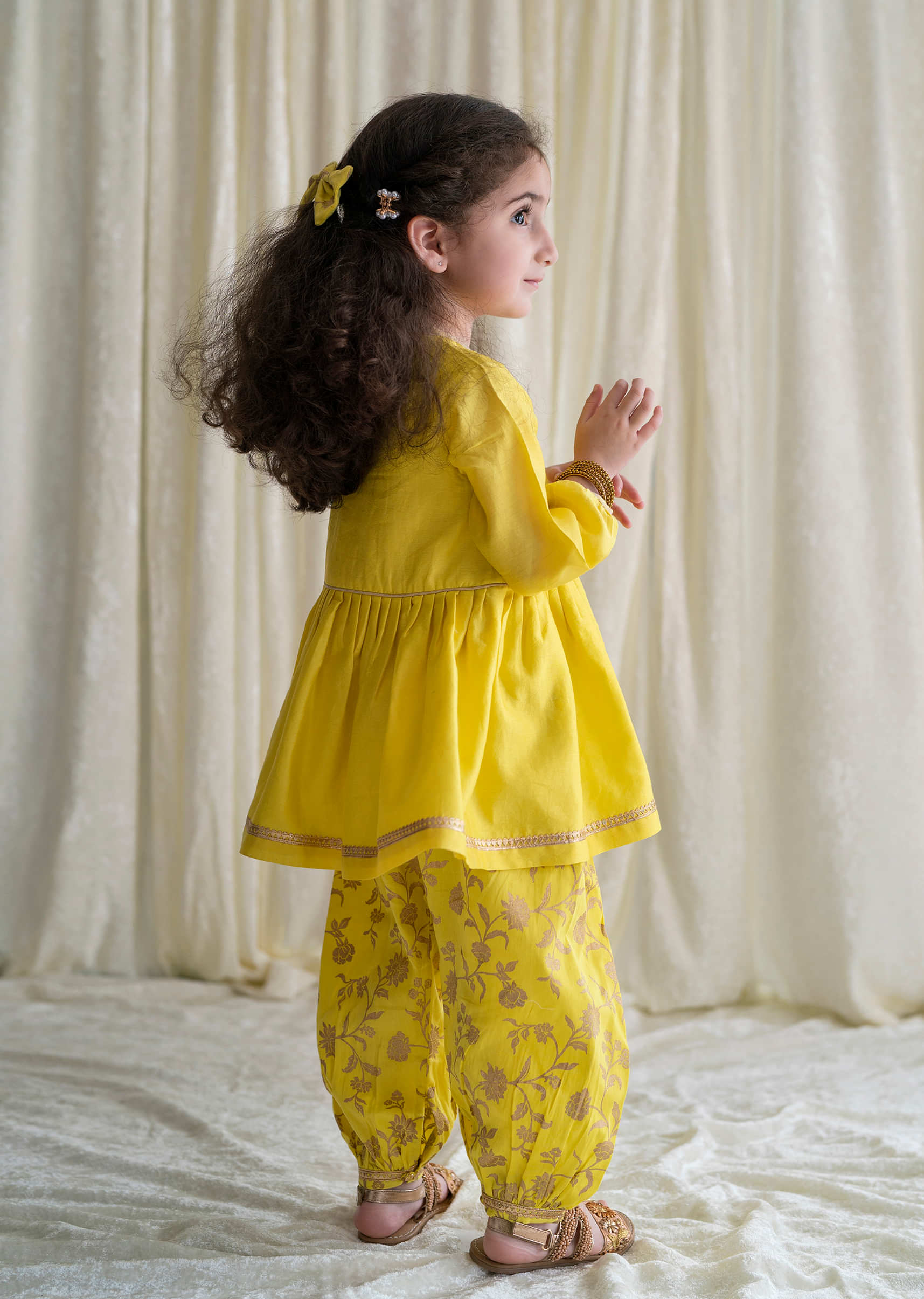 Kalki Girls Combo Of Canary Yellow Embroidered Angrakha Set And Gold Printed Bow Hairclip
