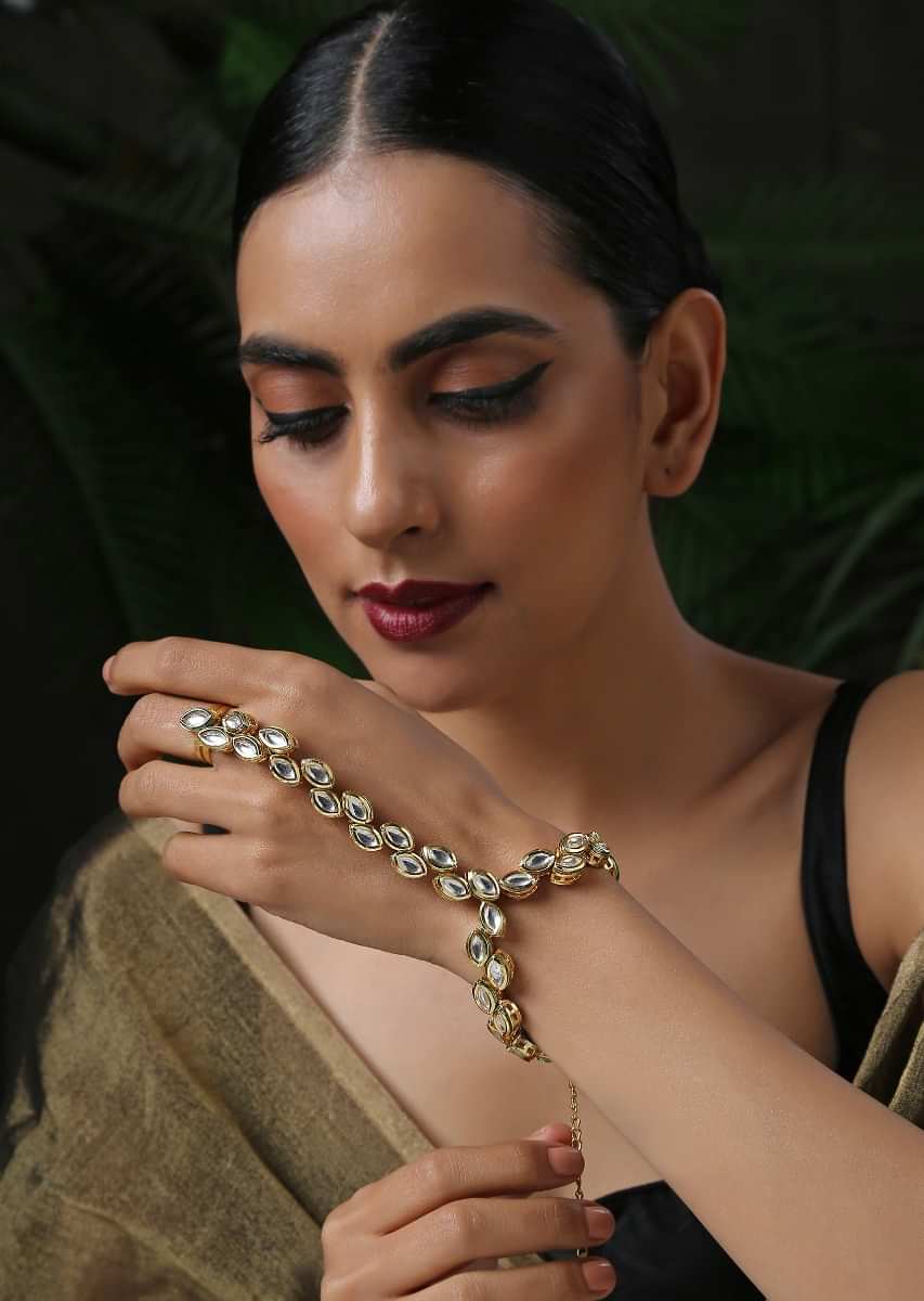 Gold Plated Hathphool Featuring Kundan Arranged In An Exquisite Pattern That Wraps Elegantly On Your Finger By Paisley Pop