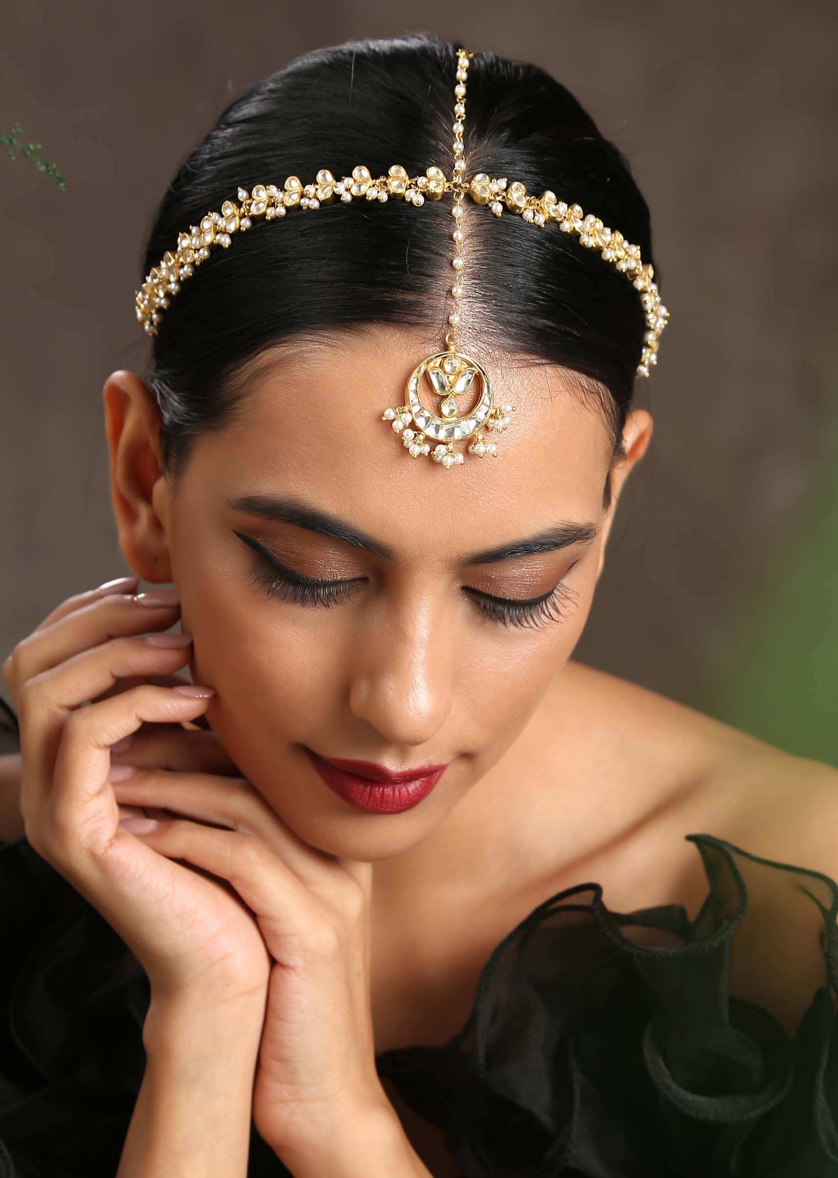 Gold Plated matha patti With Delicately Designed Kundan And Pearl Work