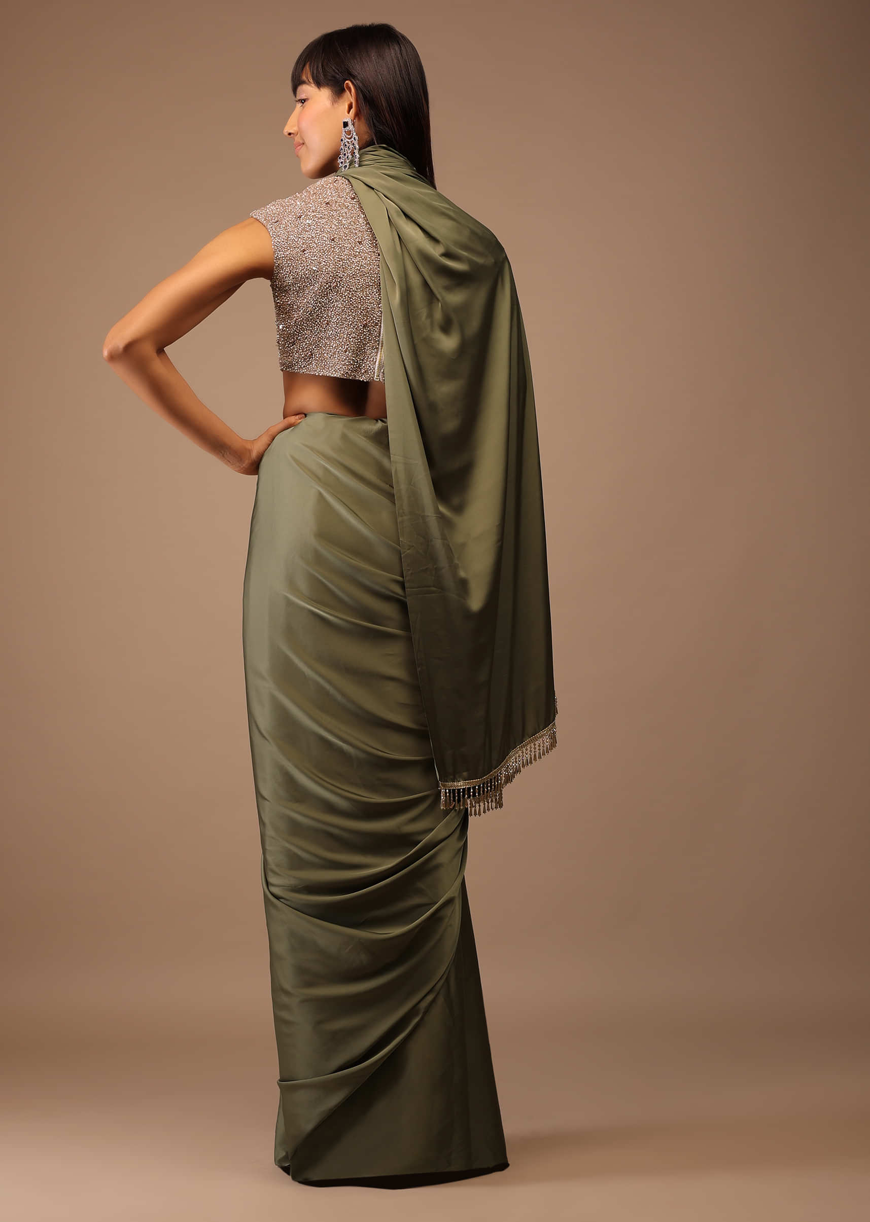 Moss Green Satin Saree With Fringes On Pallu Paired With Deep Neck Hand Embroidered Crop Top