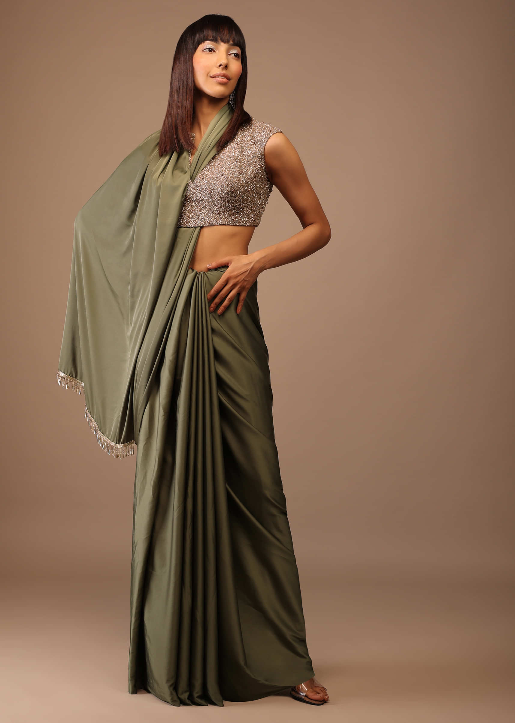 Moss Green Satin Saree With Fringes On Pallu Paired With Deep Neck Hand Embroidered Crop Top