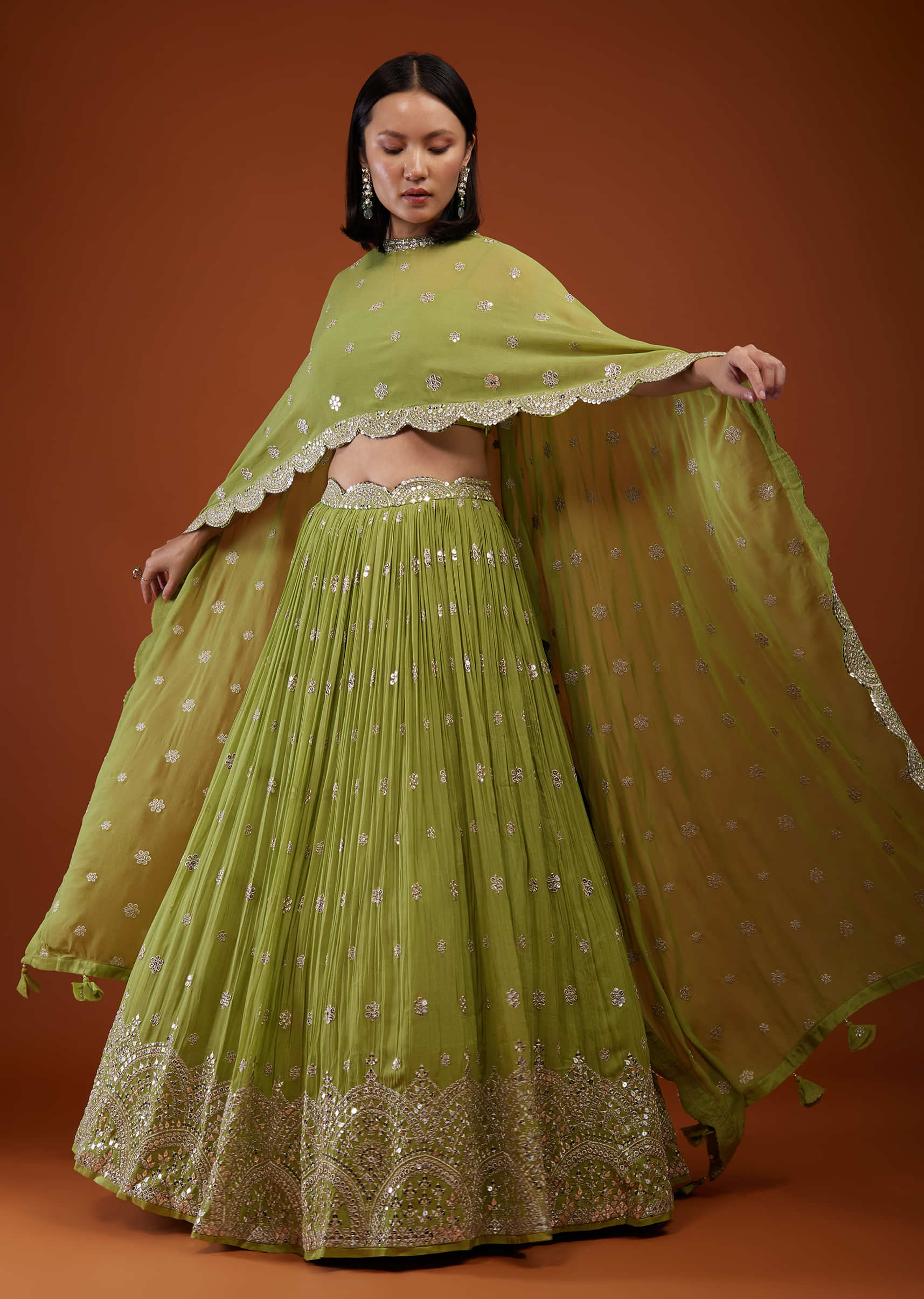 Pista Green Embroidered Lehenga In Georgette With Cape