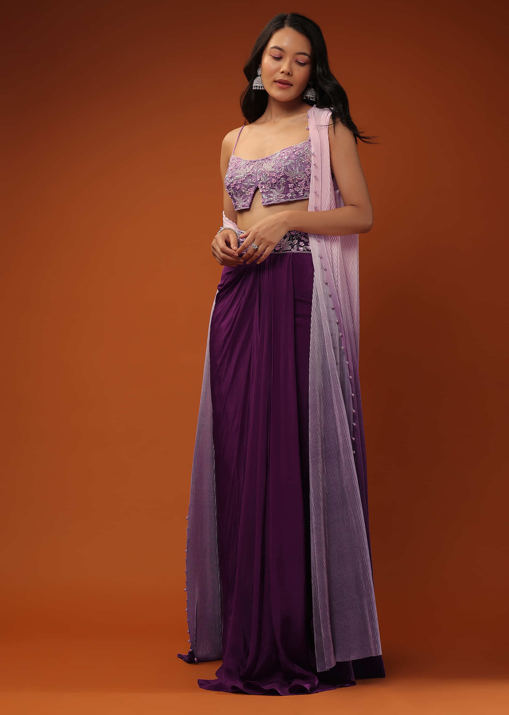 Imperial Purple Dhoti Skirt And A Crop Top In Sequins Embroidery, Paired With A Ombre Extended Jacket In Sleeveless