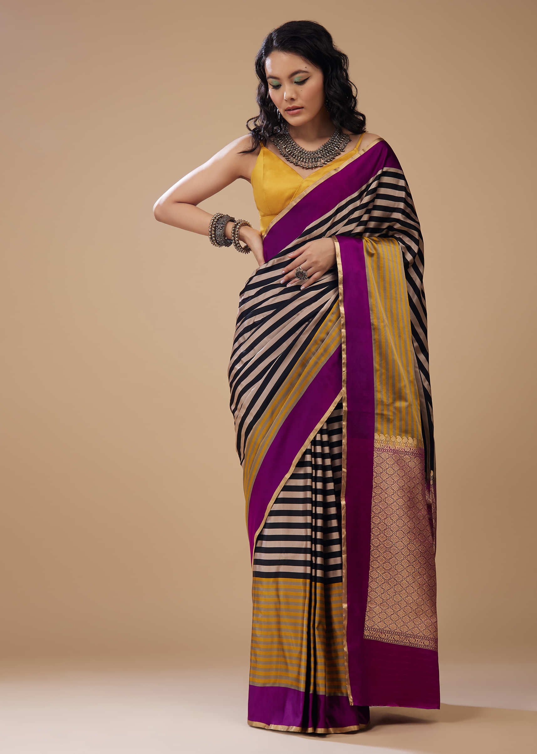 Plum Purple Satin Printed Saree With Gold And Black Stripes
