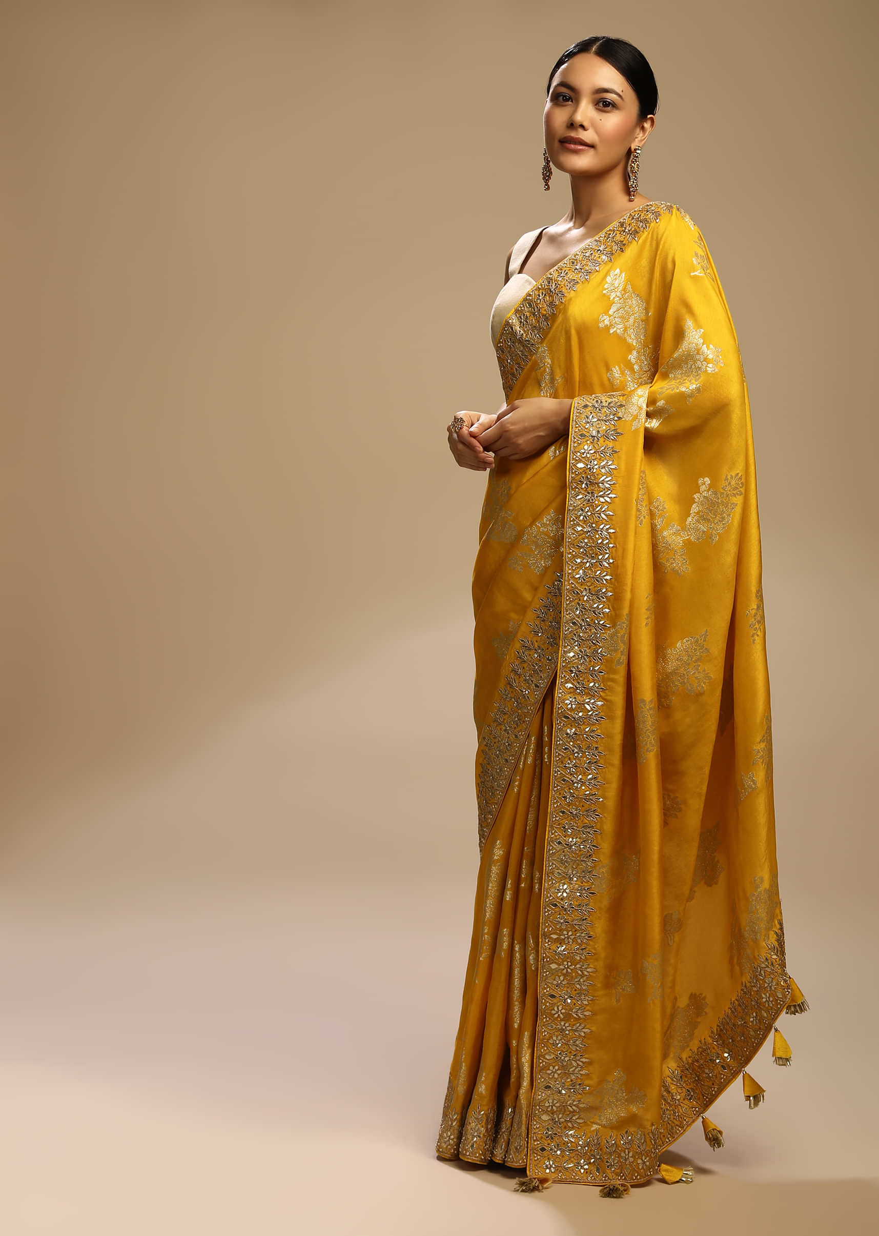 Amber Yellow Saree In Dupion Silk With Woven Floral Motifs And Gotta Embroidered Floral Border