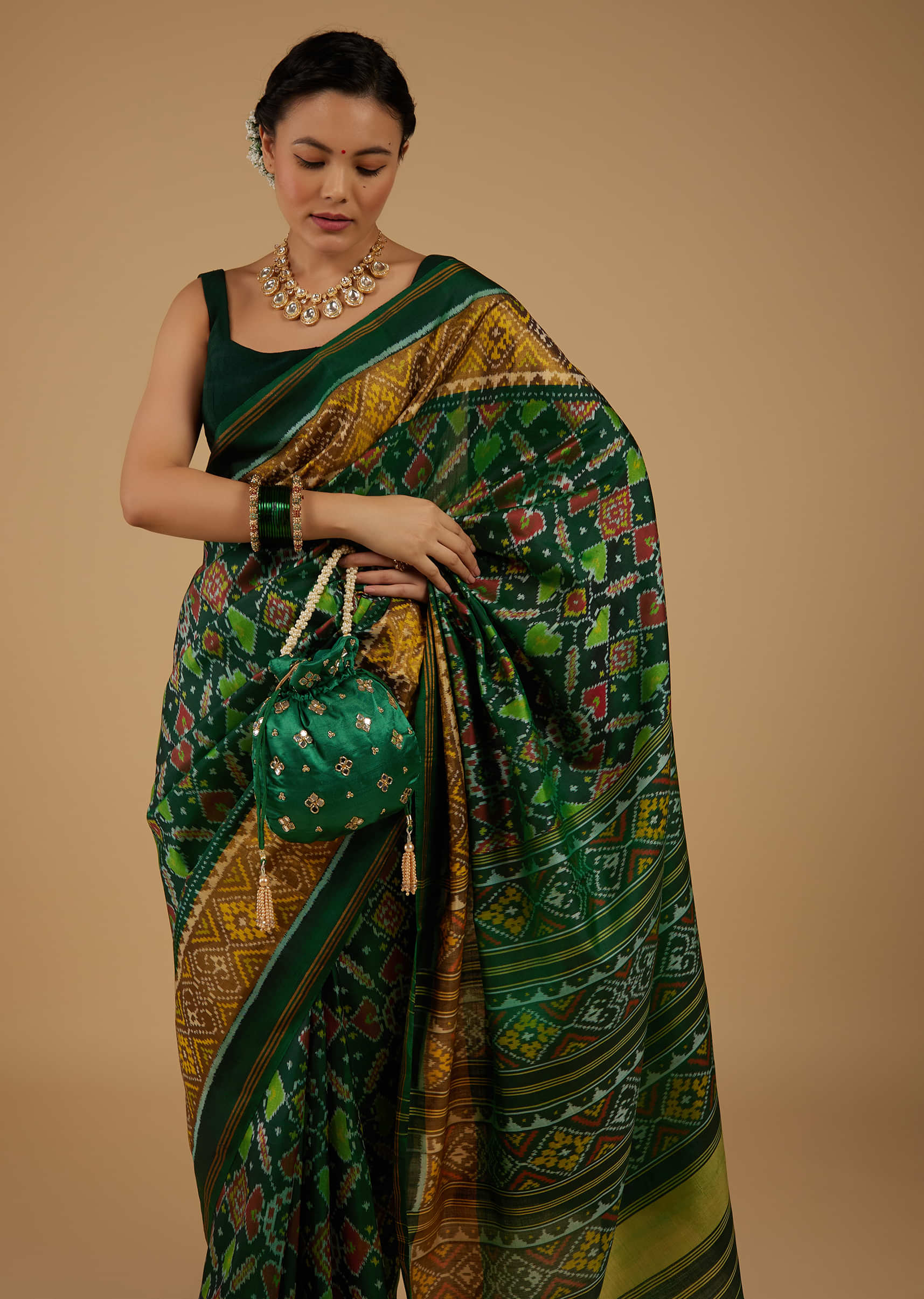 Deep Green Saree In Silk With Ikat Weave Patola Work