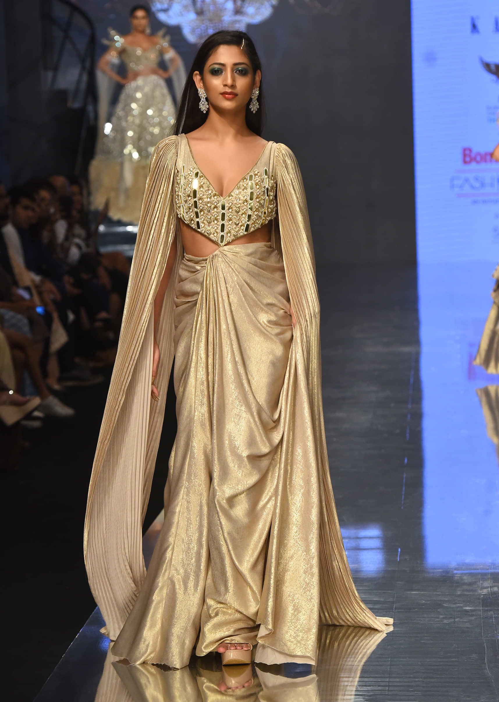 Mocha Brown Gown With A Pre-Pleated Dhoti Skirt And Royal Cape Sleeves - NOOR 2022