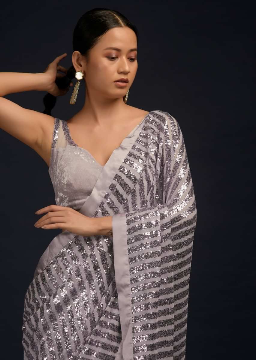 Lavender Ready Pleated Saree In Net With Sequin Embellished Stripes And Velvet Crop Top With Sequins On The Shoulders