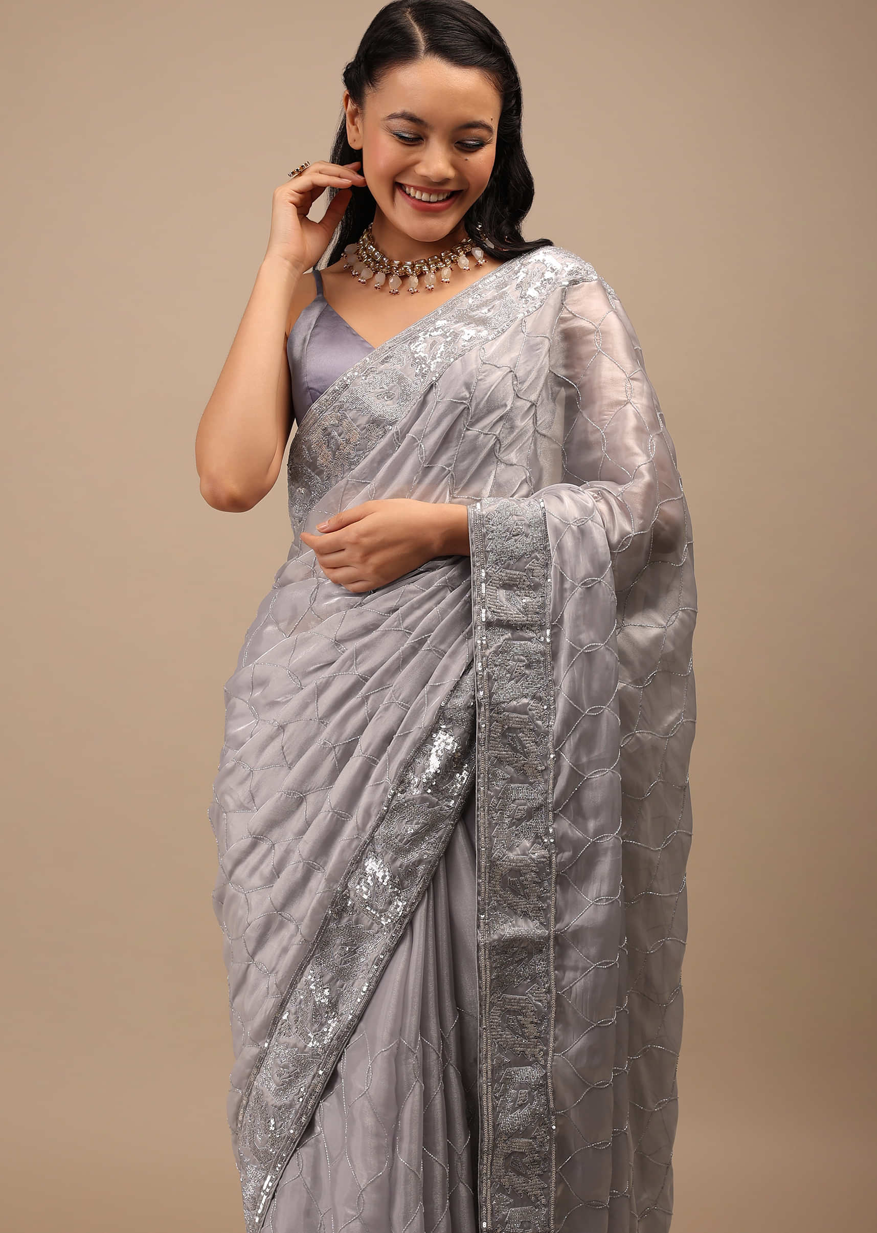 Lilac Grey Tissue Saree In Cut Dana Embroidery In A Moroccan Jaal, The Border Has Resham Work And Moti Tassel Embroidery