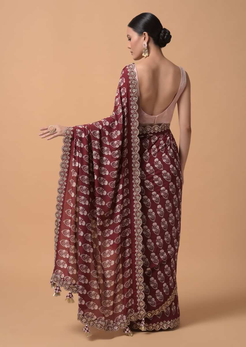 Maroon Saree With Floral Printed Buttis And Gotta Embroidered Border  