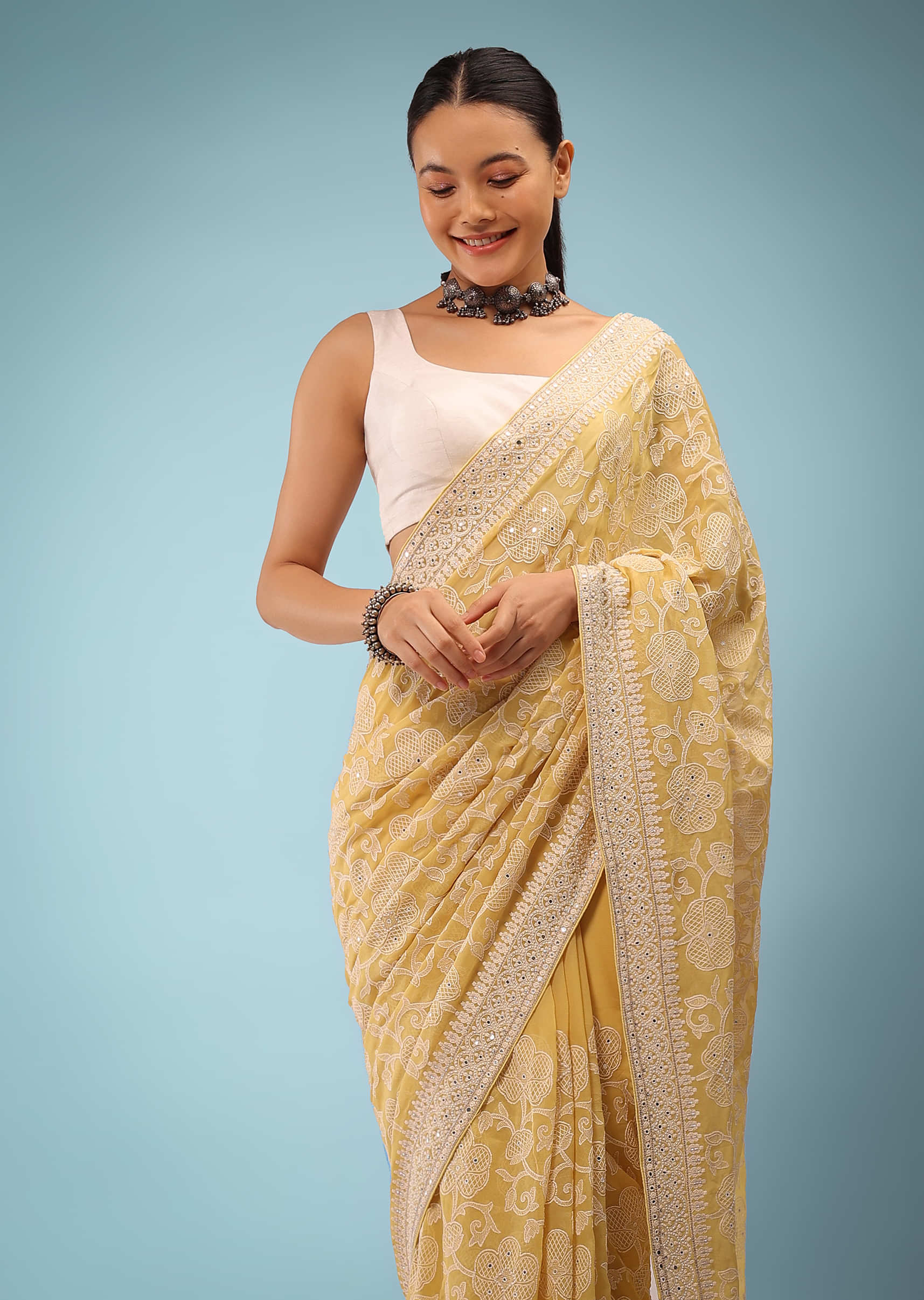 Misted Yellow Lucknowi Saree In Mirrored Work, It Comes In Cut Dana And Sequins Detailing Buttis On The Pallu.