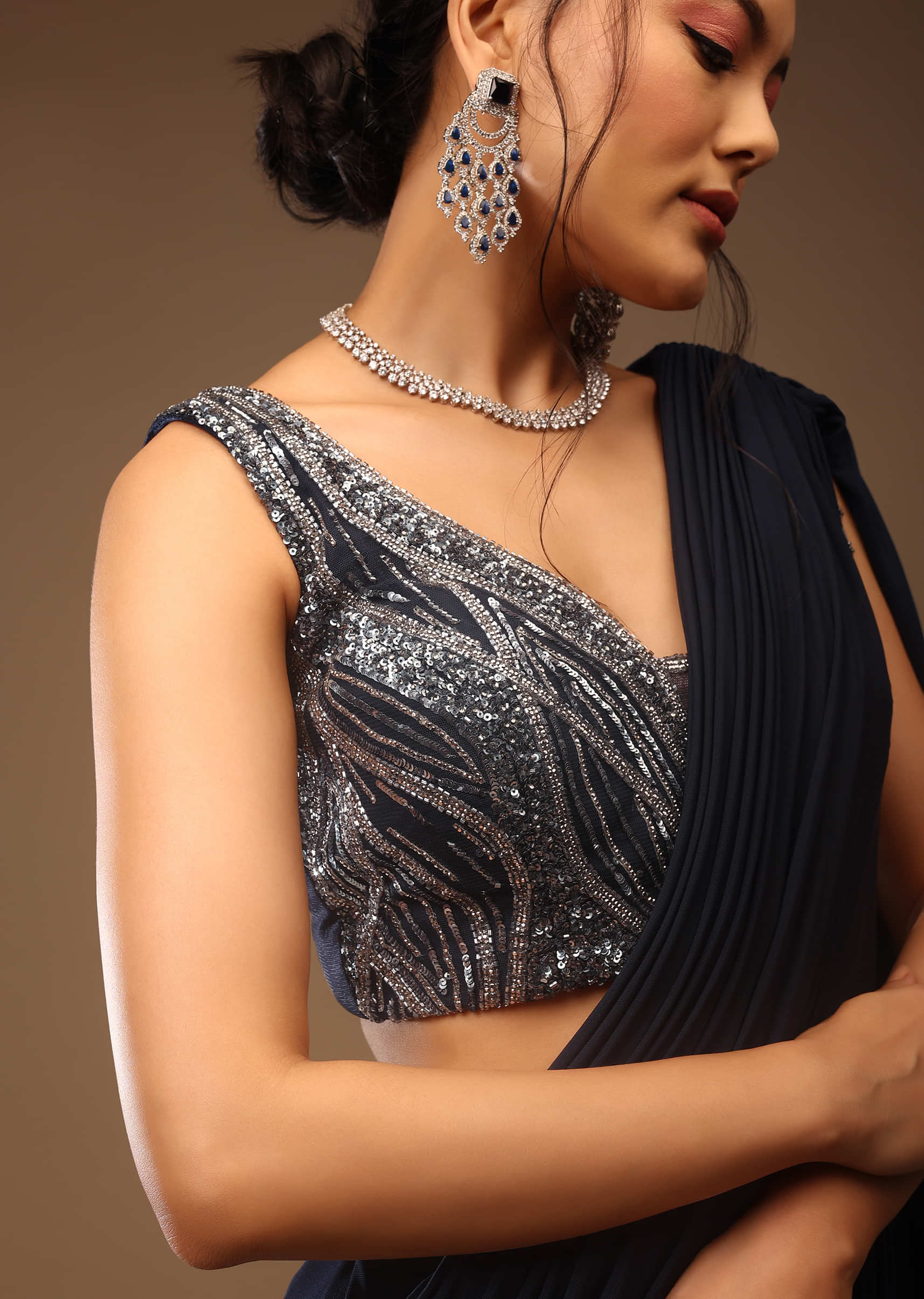Mood Indigo Blue Ready-Pleated Saree With A Crop Top In Sequins Embroidery Corset Neckline With A Tie-Up Tassel Dori At The Back