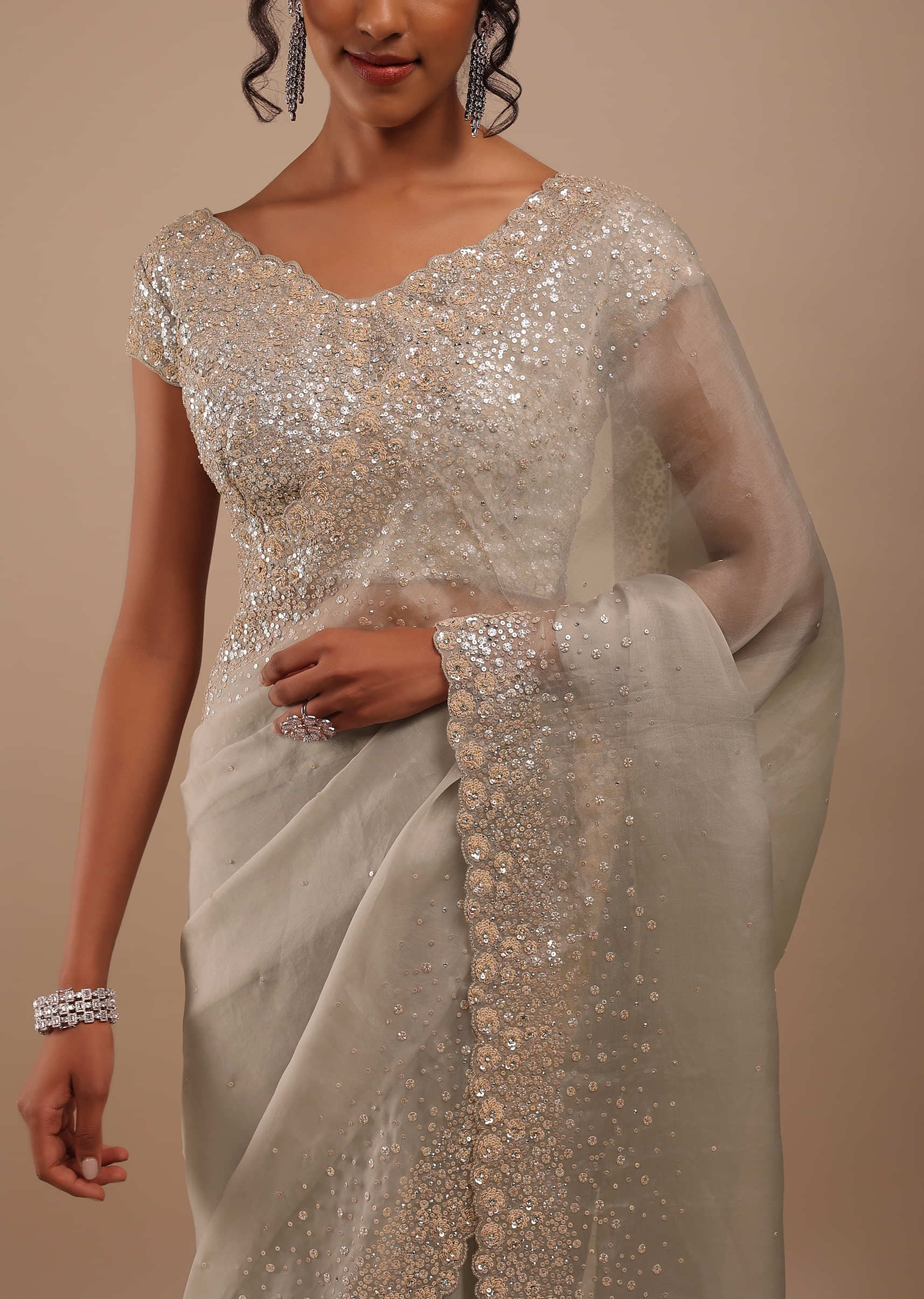 Moonstruck Grey Organza Saree In Grey And Cream Sequins 3D Floral Motifs Embroidery With The Cutwork Detailing On Border