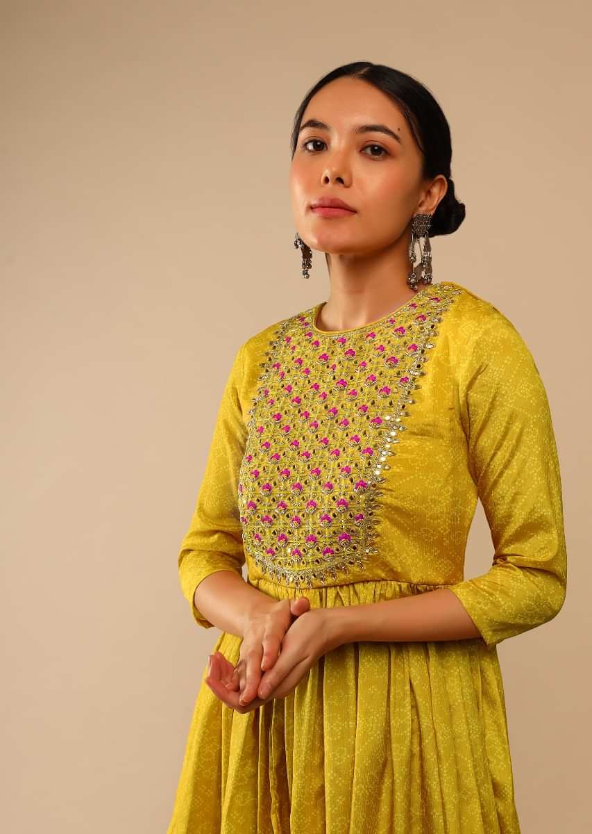 Mustard Sharara Suit In Crepe With Bandhani And Lehariya Print Paired With Resham And Mirror Embroidered Peplum Kurti  