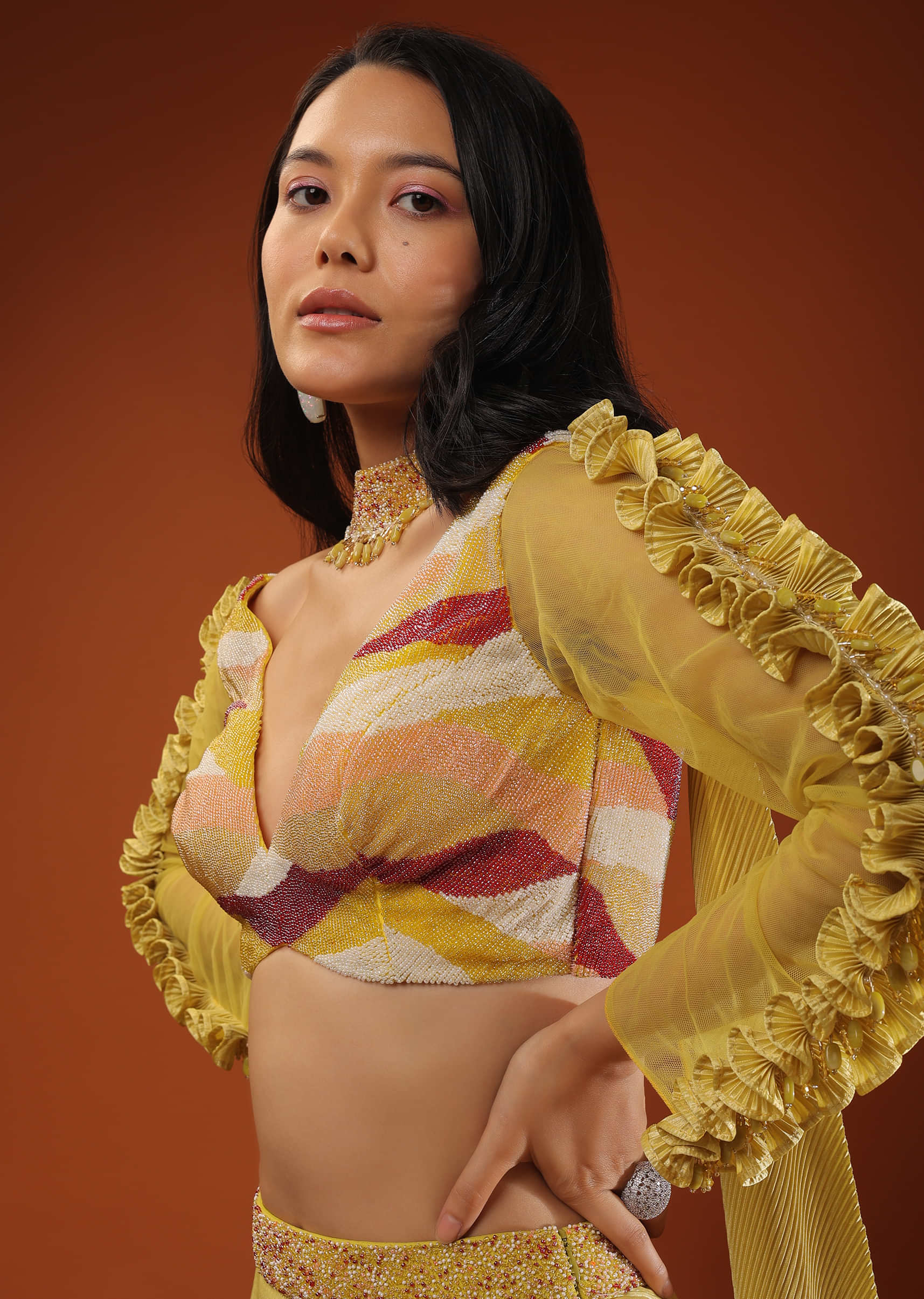 Mustard Yellow Lehenga And A Crop Top With Frills On The Top Of The Sleeves, Crafted In Crepe With Moti Embroidery