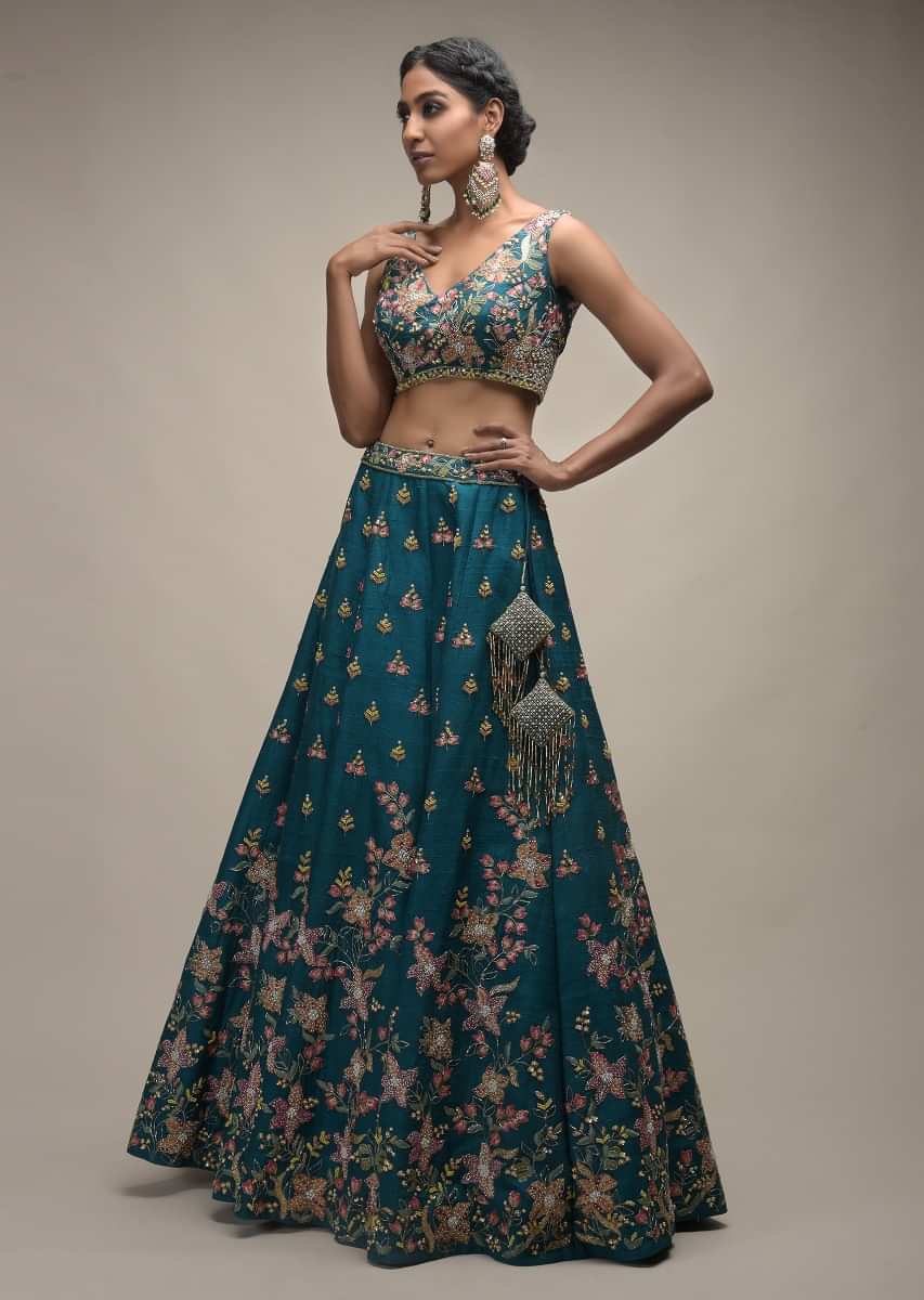 Ocean Green Lehenga Choli In Raw Silk With Colorful Resham Embroidered Spring Blossoms 