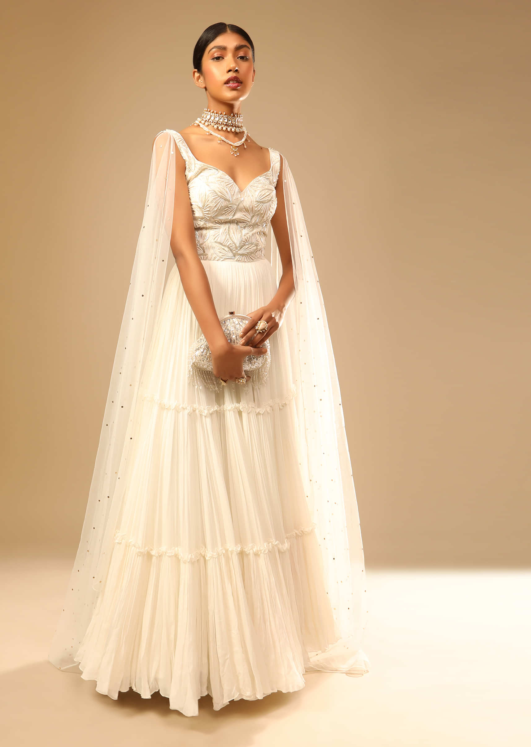 Off White Gown In Georgette With Tiered Flare And Hand Embroidered Leaf Motifs On The Bodice  
