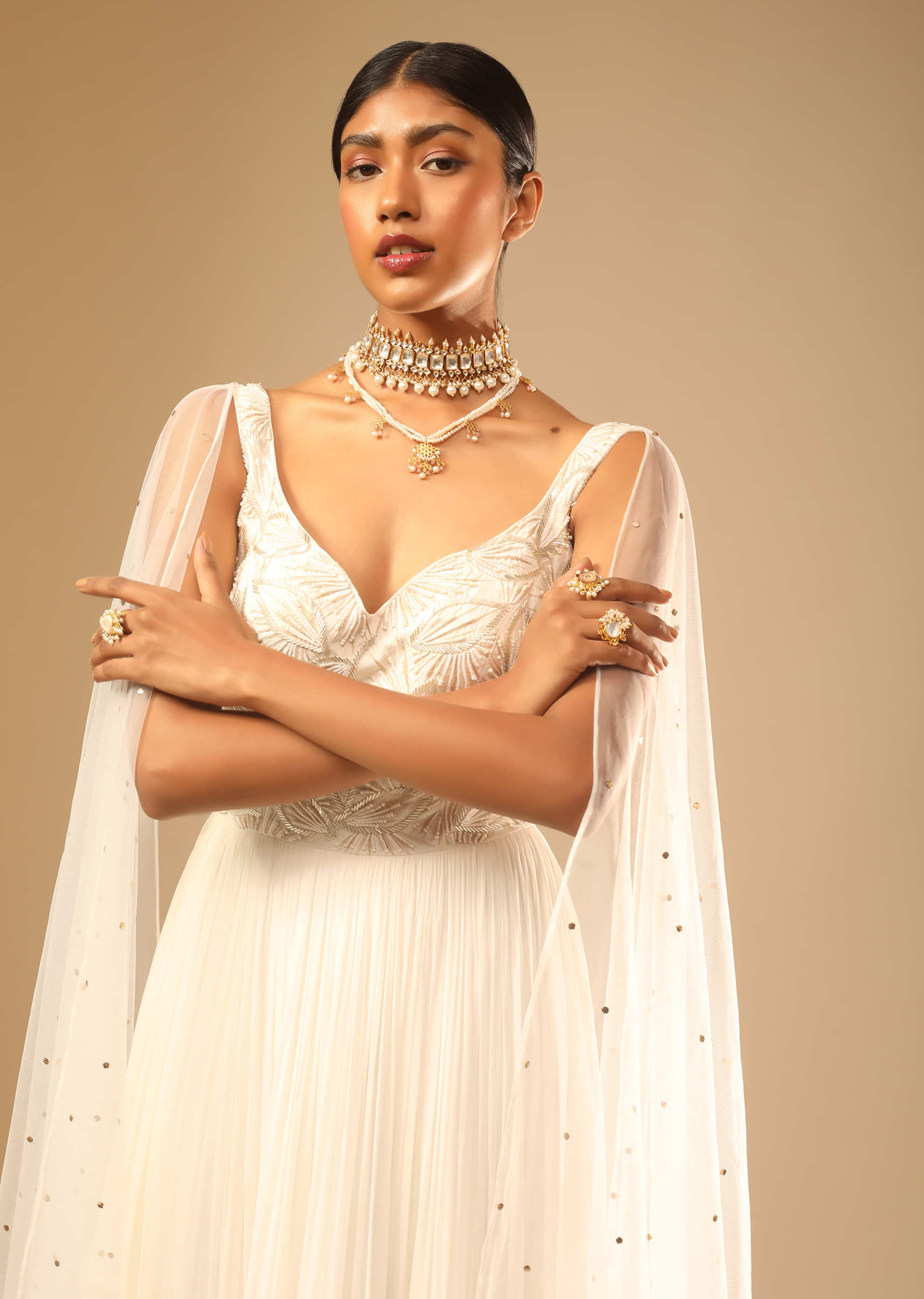 Off White Gown In Georgette With Tiered Flare And Hand Embroidered Leaf Motifs On The Bodice  