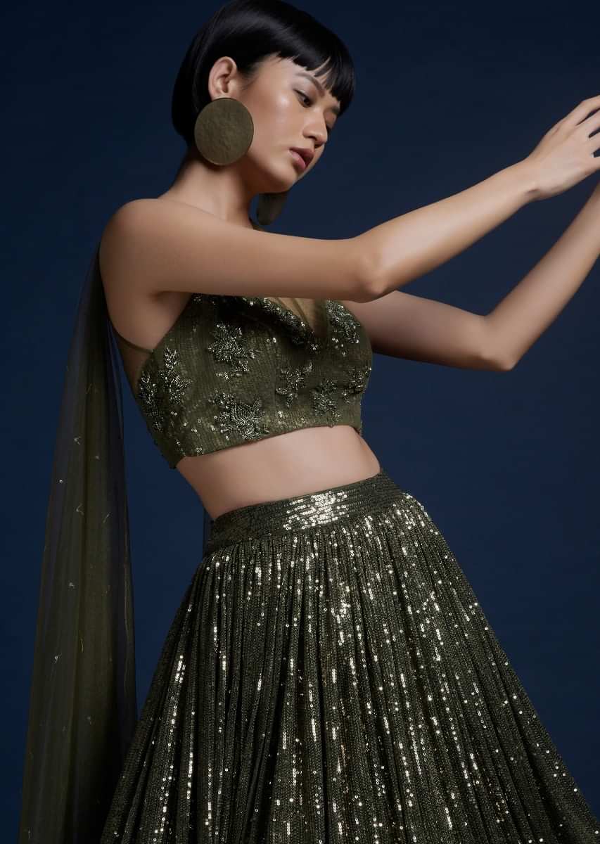 Olive Green Lehenga Embellished In Sequins And Cut Dana Embellished Crop Top With Attached Net Cape