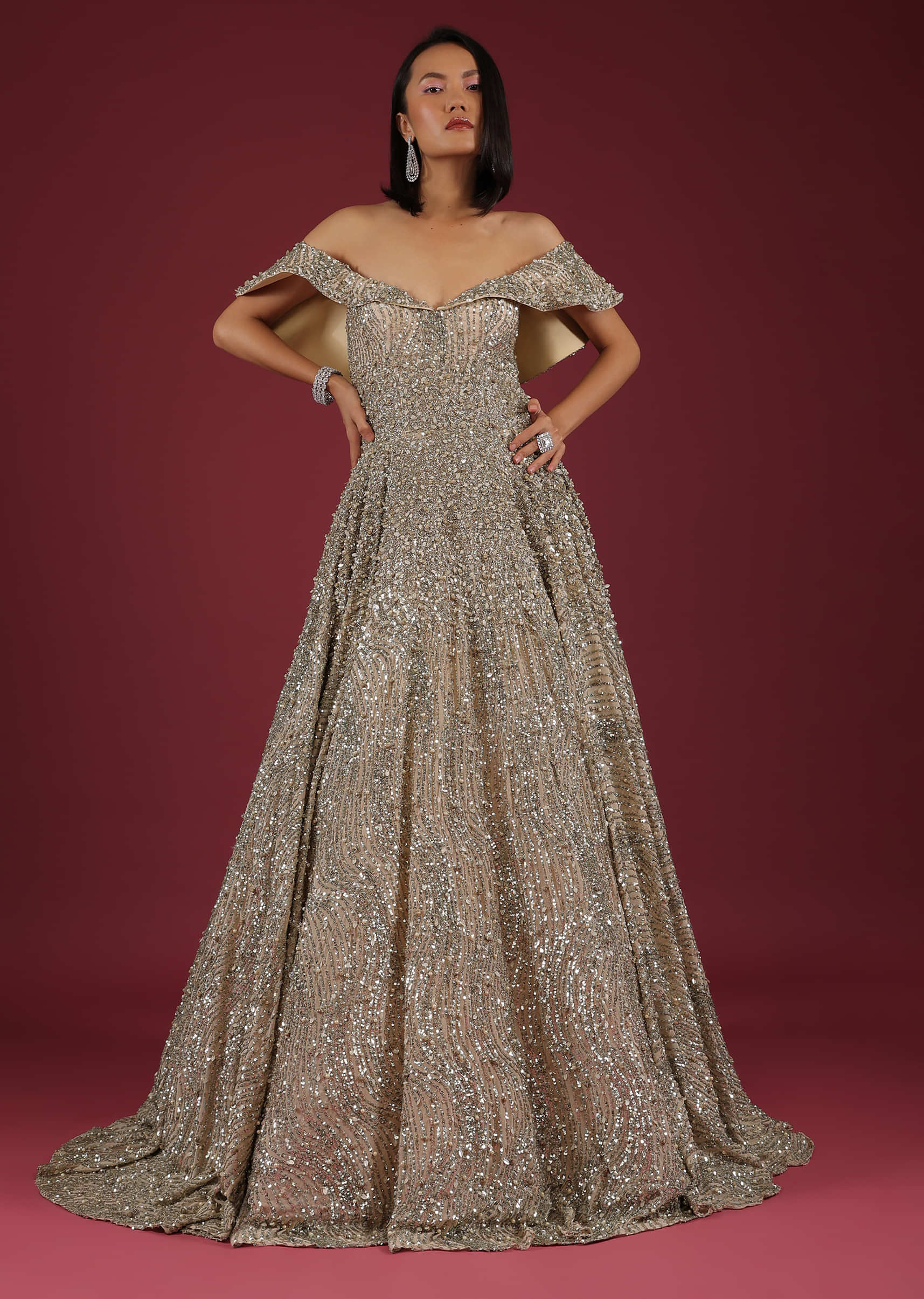 Net Oyster Gown With Layers, Embroidery Of 3D Petals And Moti, And A Cold Shoulder Neckline