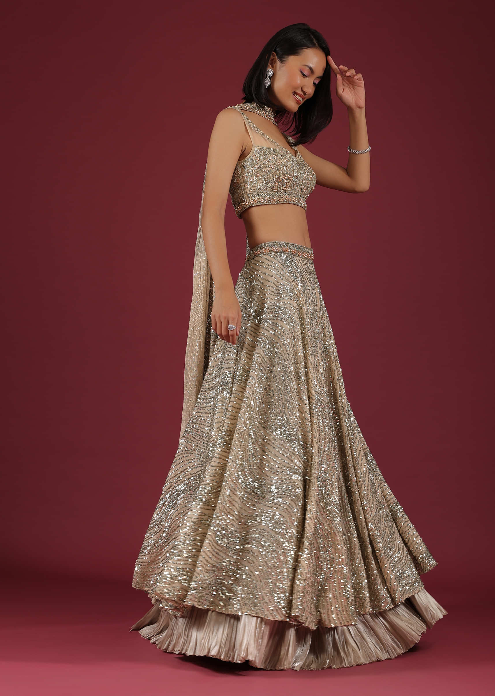 Oyster Lehenga And A Crop Top In 3D Petal Motifs Embroidery, Crafted In Net With A Side Zip Closure