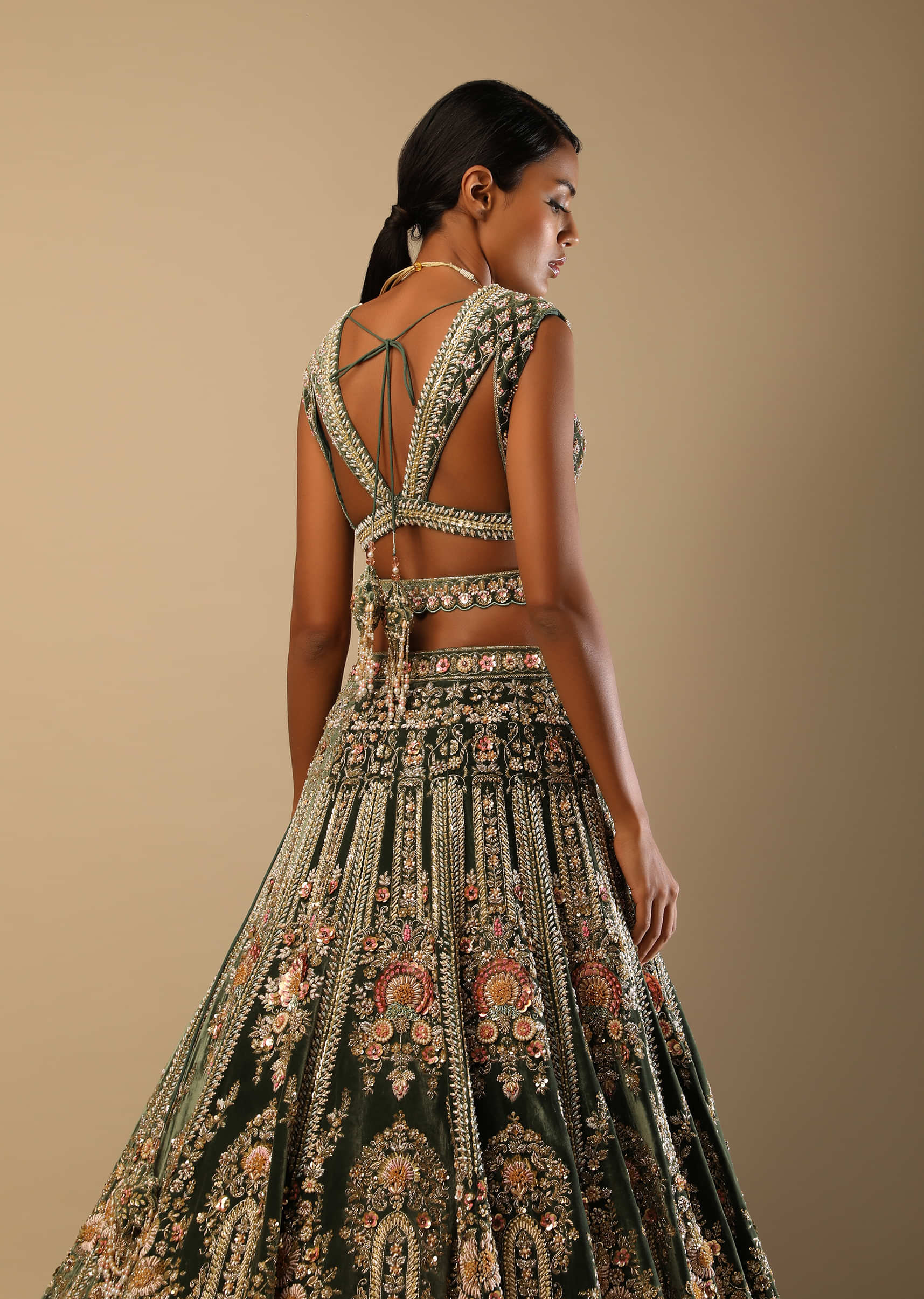 Palace Green Lehenga Choli In Velvet With Multi Colored Hand Embroidered Heritage Kalis With Hints Of Flowers 