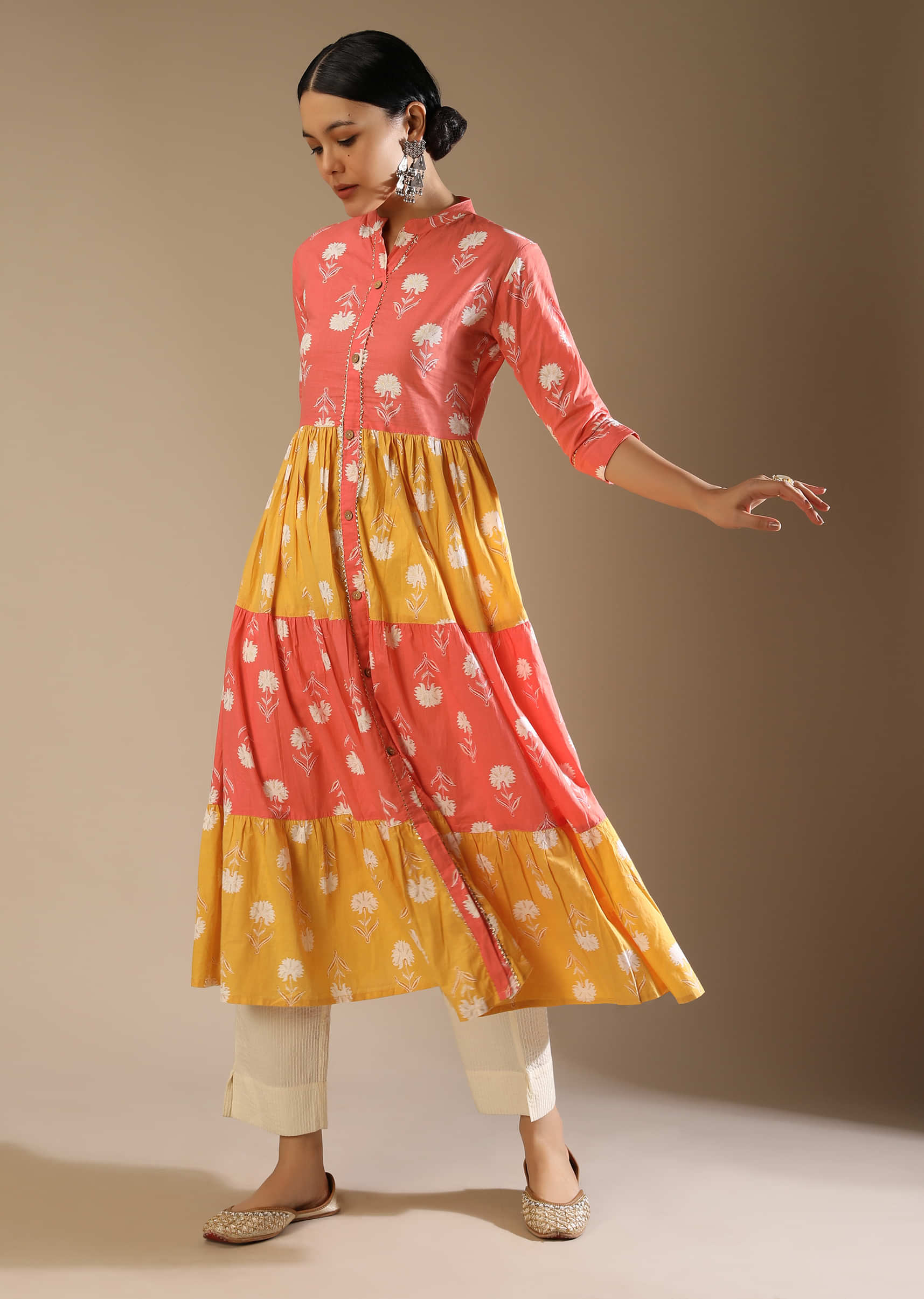 Peach And Yellow Tiered Kurti In Cotton With Floral Printed Buttis And Gotta Lace Work 