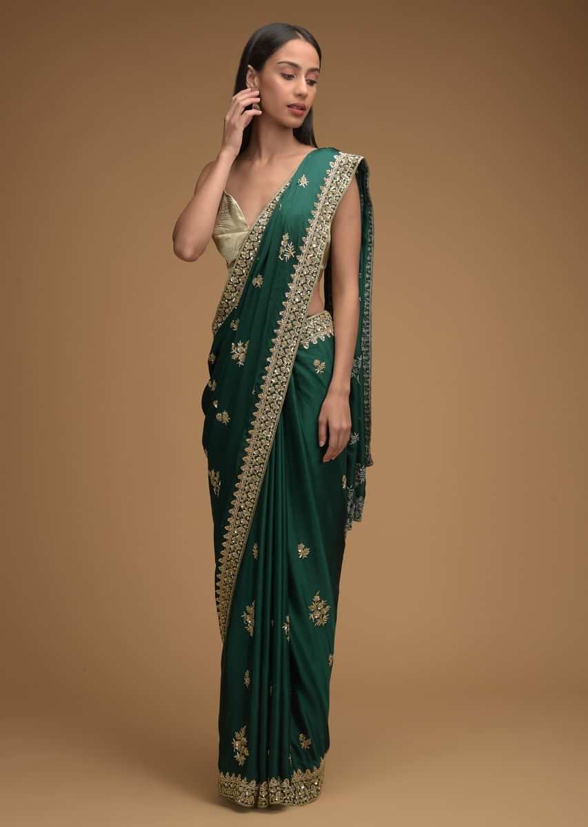 Bottle Green Saree In Satin With Hand Embroidered Floral Buttis Using Cut Dana And Sequins Work Along With Unstitched Blouse  