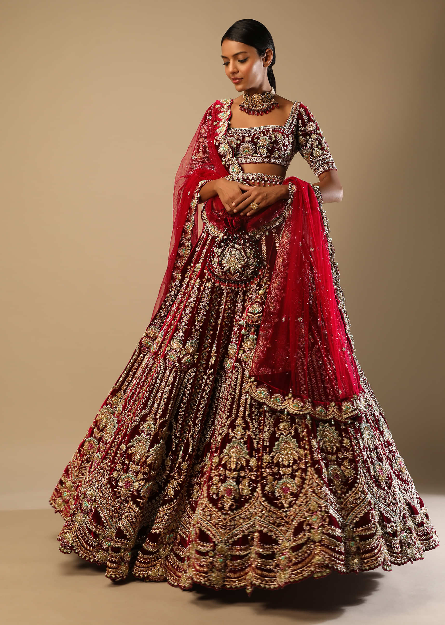Persian Red Lehenga Choli In Velvet With Multi Colored Hand Embroidered Mughal Kalis And Floral Motifs 
