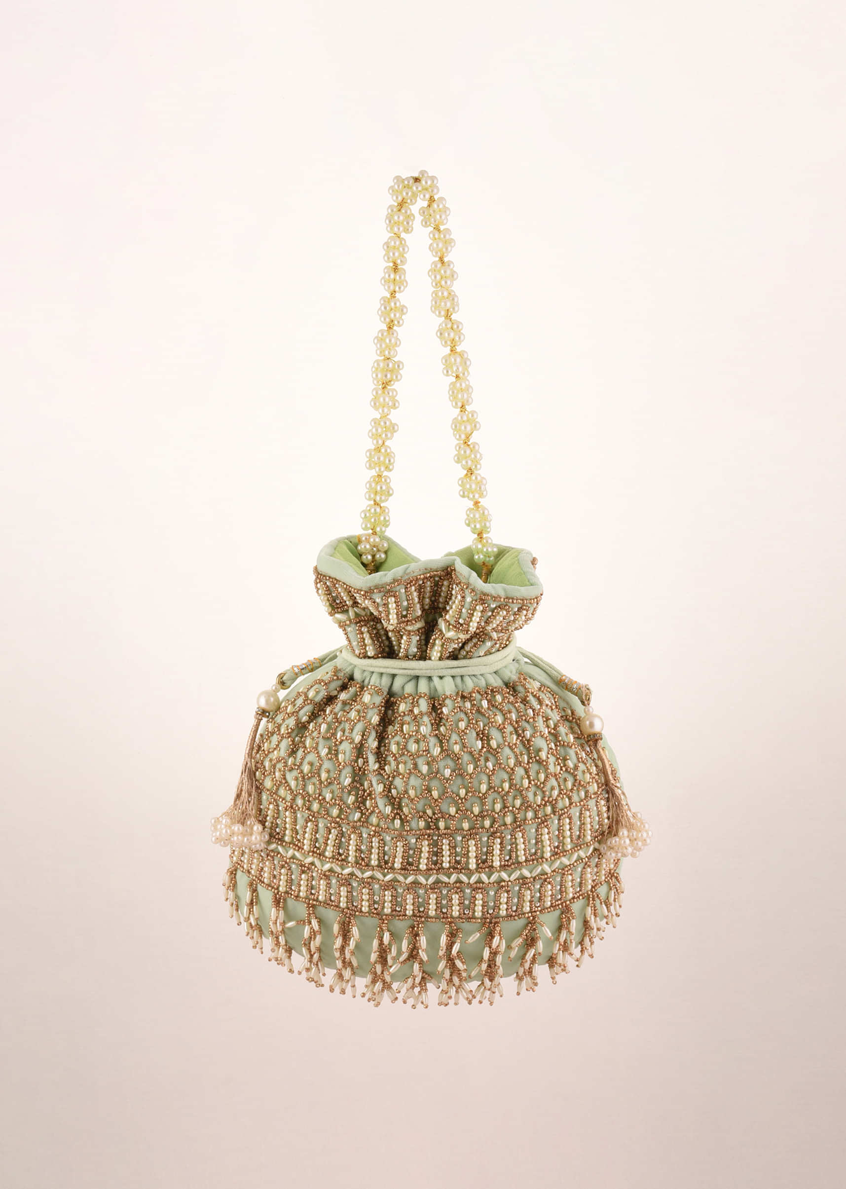 Pista Green Potli In Velvet Heavily Embroidered With Beads And Moti Work In Scalloped And Tassel