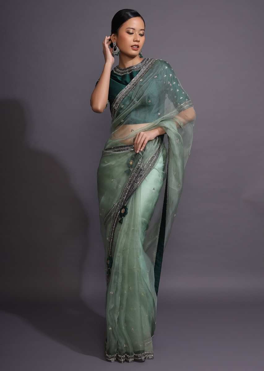 Pista Green Saree In Organza With Mirror Embellished Buttis And Contrasting Dark Green Border  