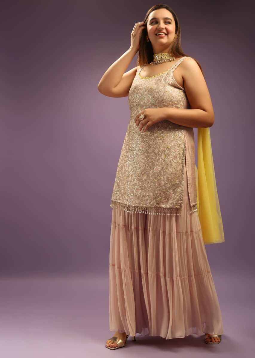 Powder Peach Georgette Sharara Suit Paired With Pastel Colored Resham And Sequins Embroidered Jaal And Cut Dana Fringes