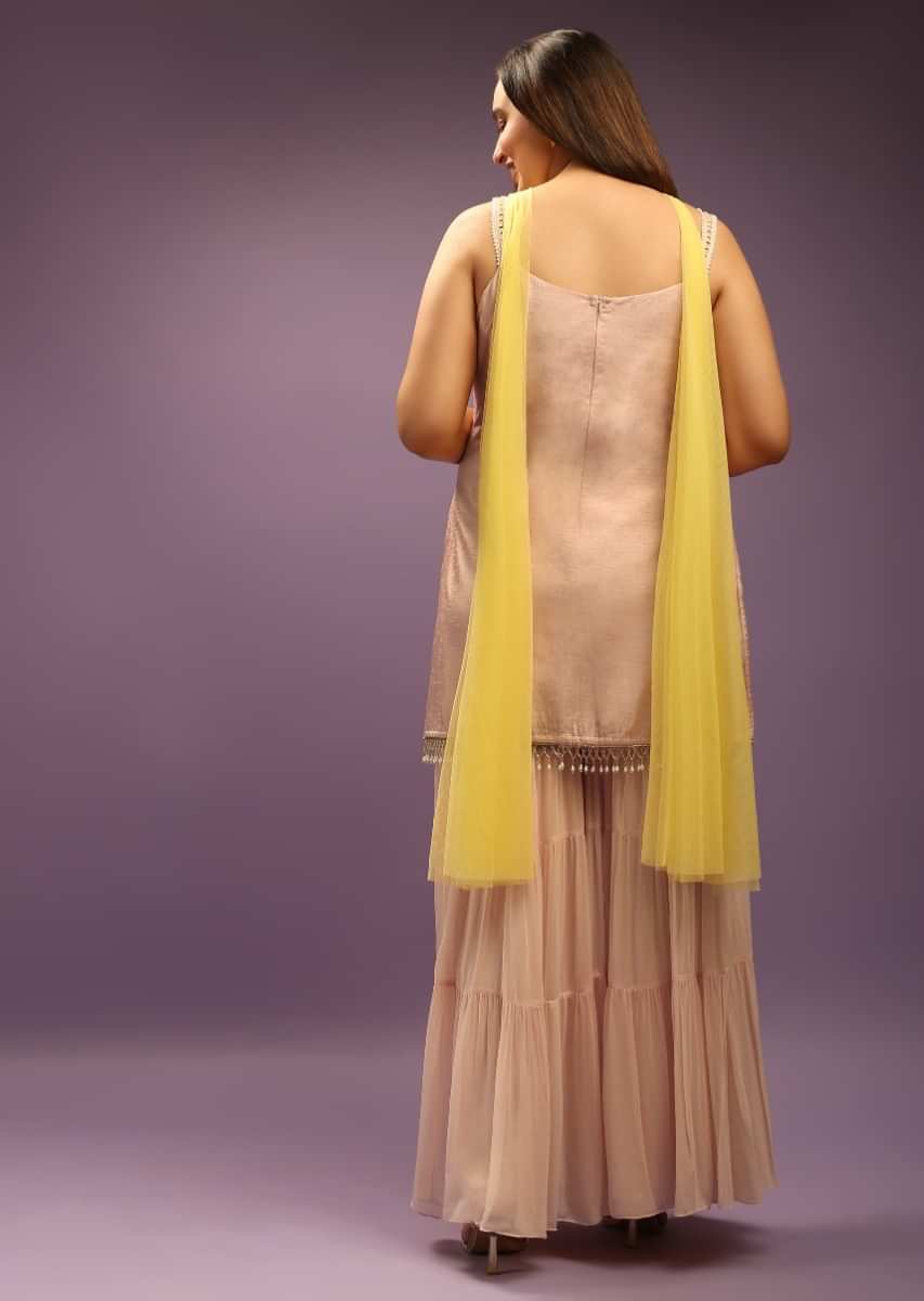 Powder Peach Georgette Sharara Suit Paired With Pastel Colored Resham And Sequins Embroidered Jaal And Cut Dana Fringes