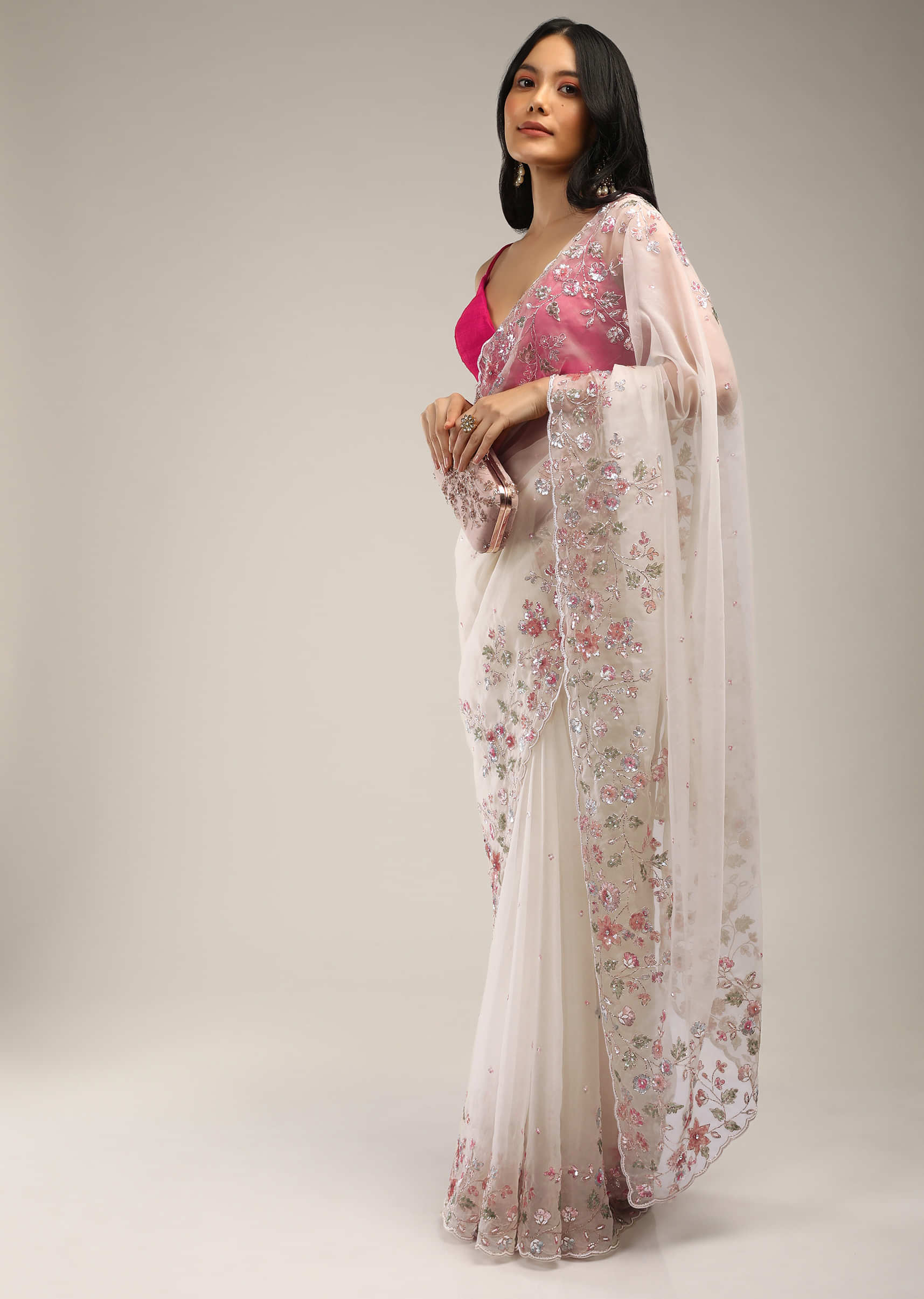 Powder White Saree In Organza With Multi Colored Sequins And Pita Zari Embroidered Floral Motifs On The Border  